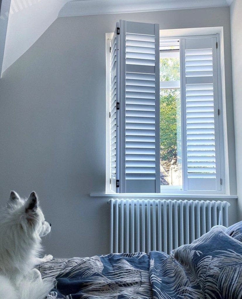 Aura white full height shutters in bedroom