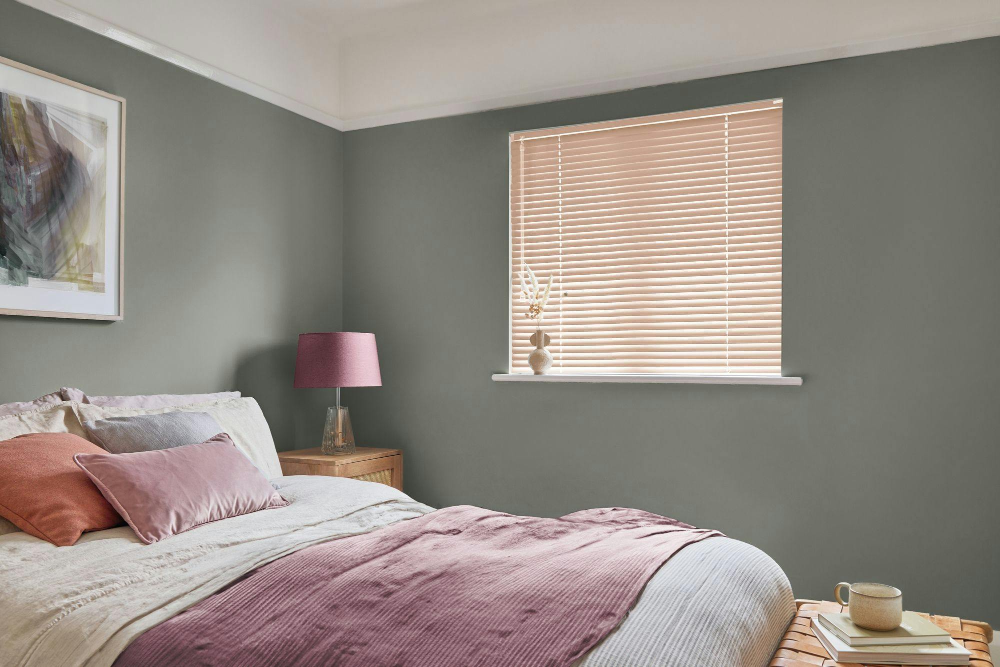 Orange venetian bedroom blind in white bedroom