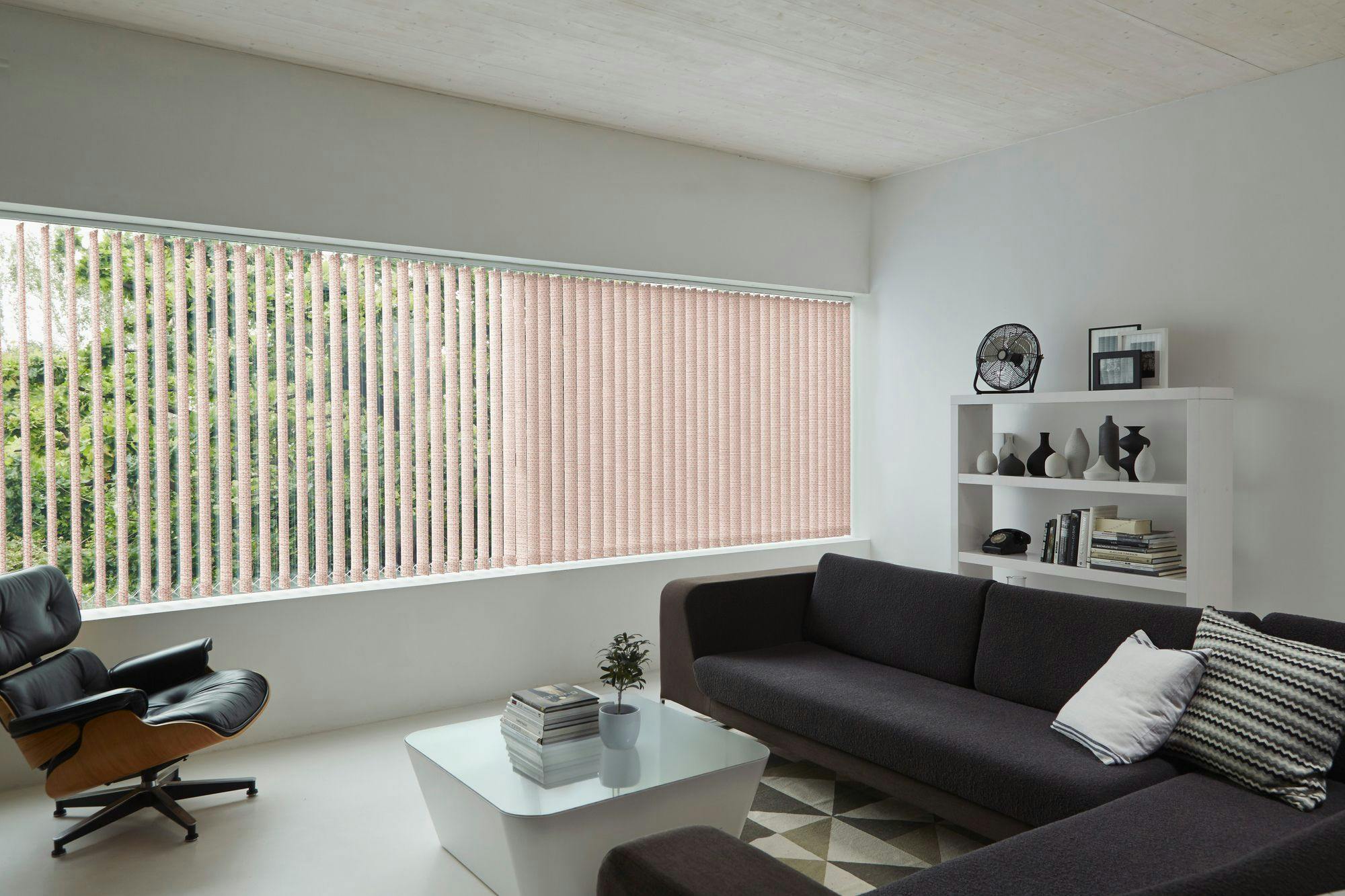 Orange vertical blinds in bright white living room