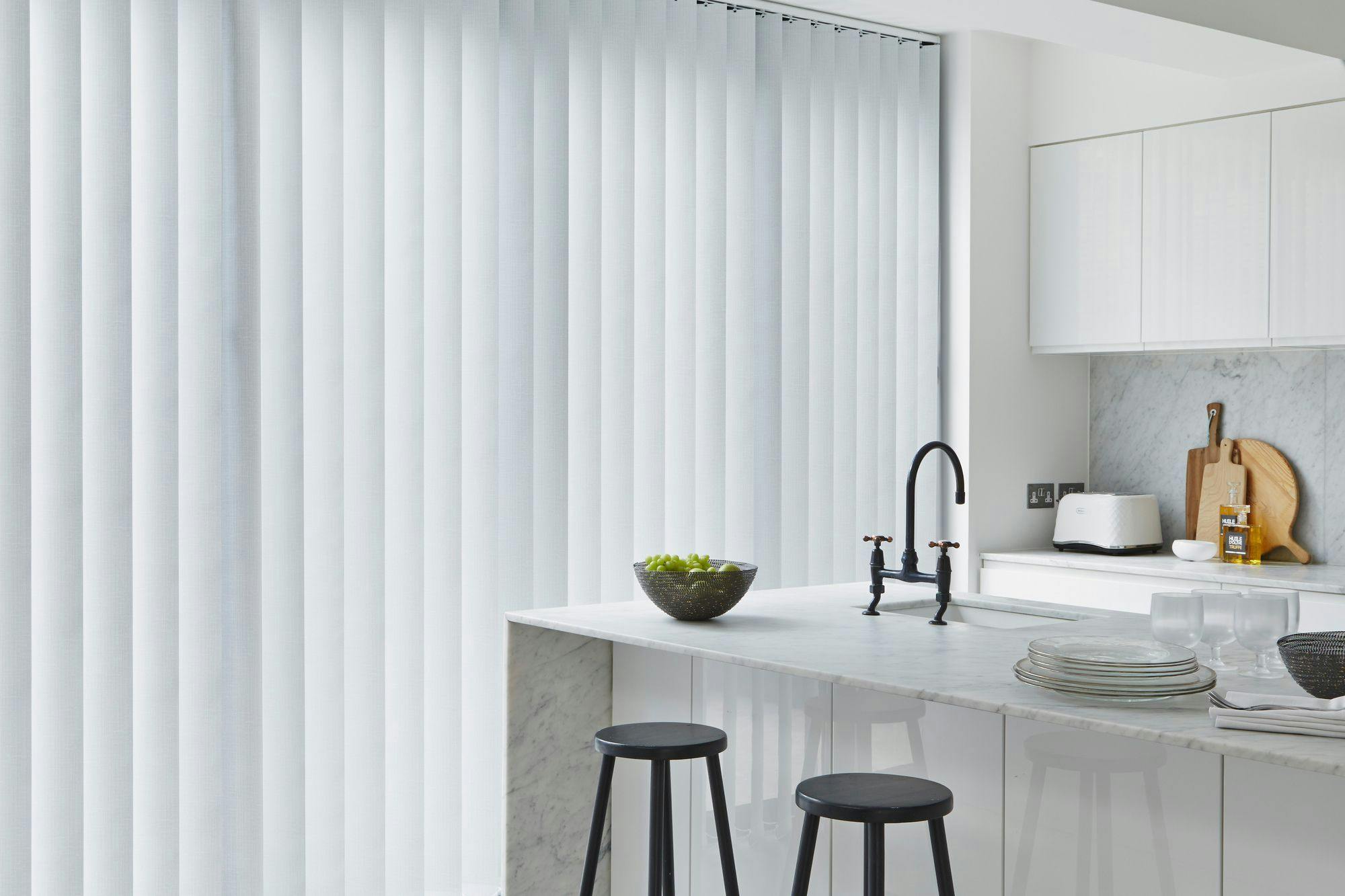 Iowa frost vertical blinds in bright white modern kitchen