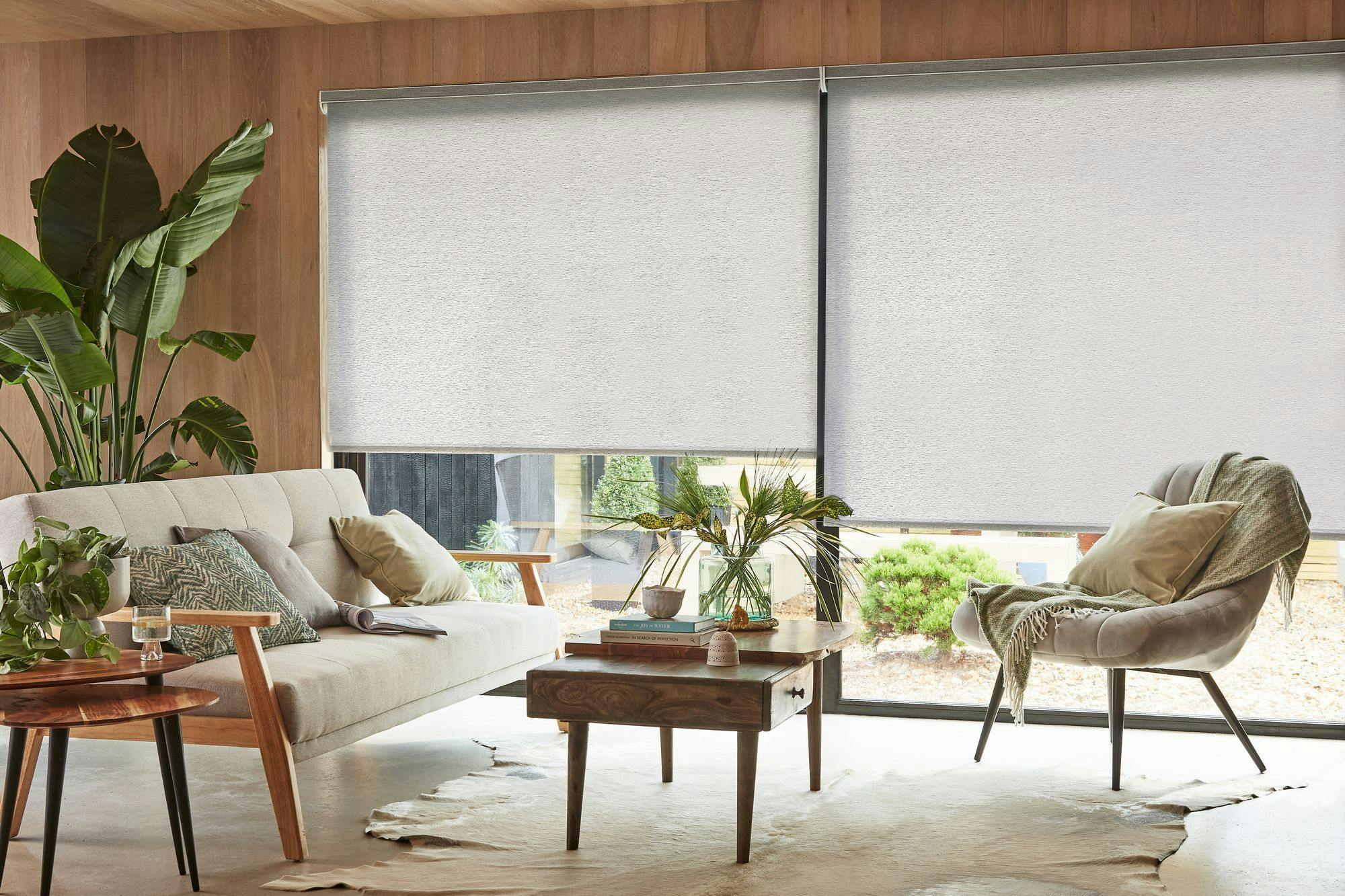 Stratford grey roller blind covering large living room windows