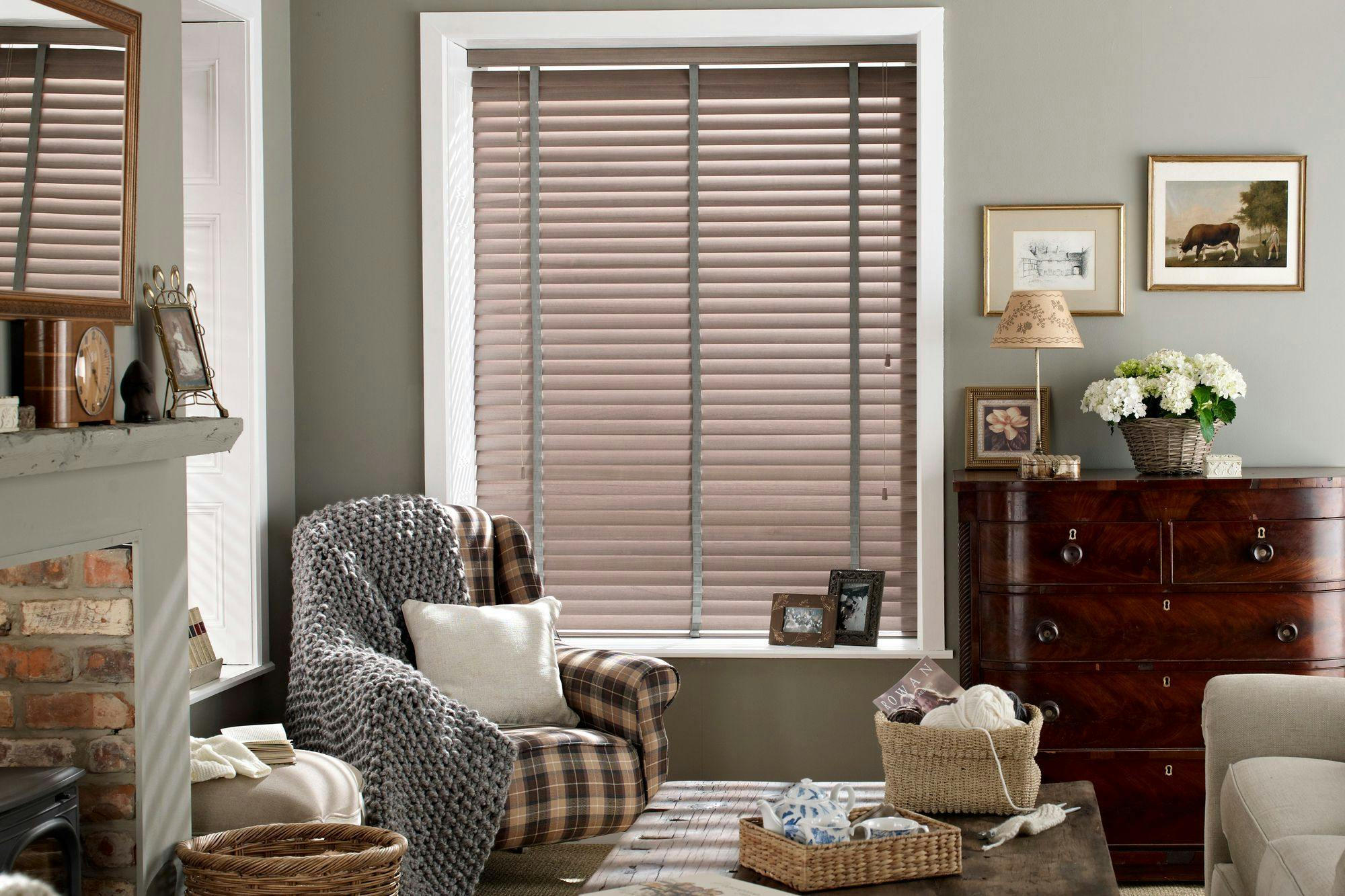 Brown wooden blinds shading a living room
