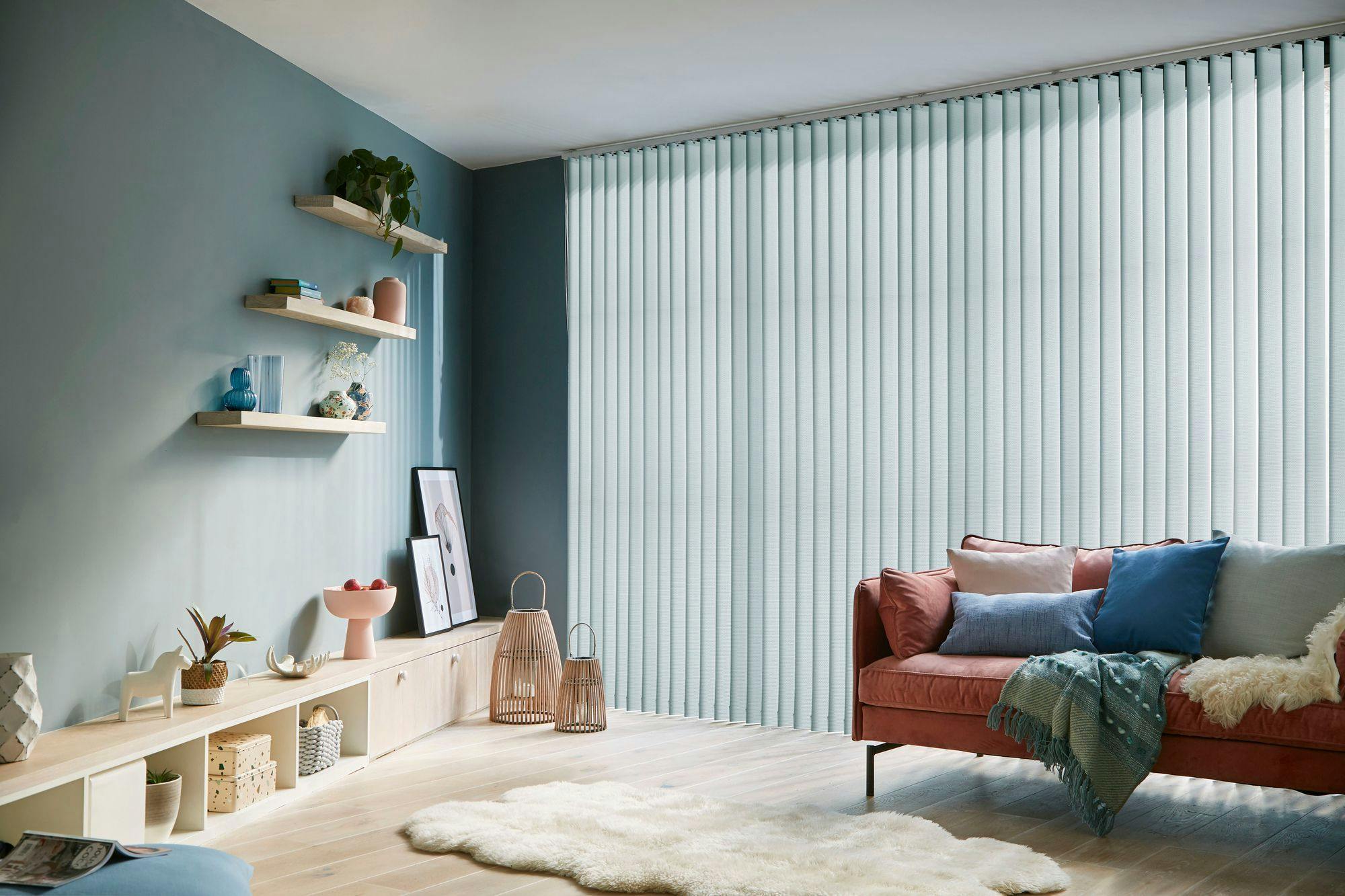 Blue vertical blinds in a blue themed living room