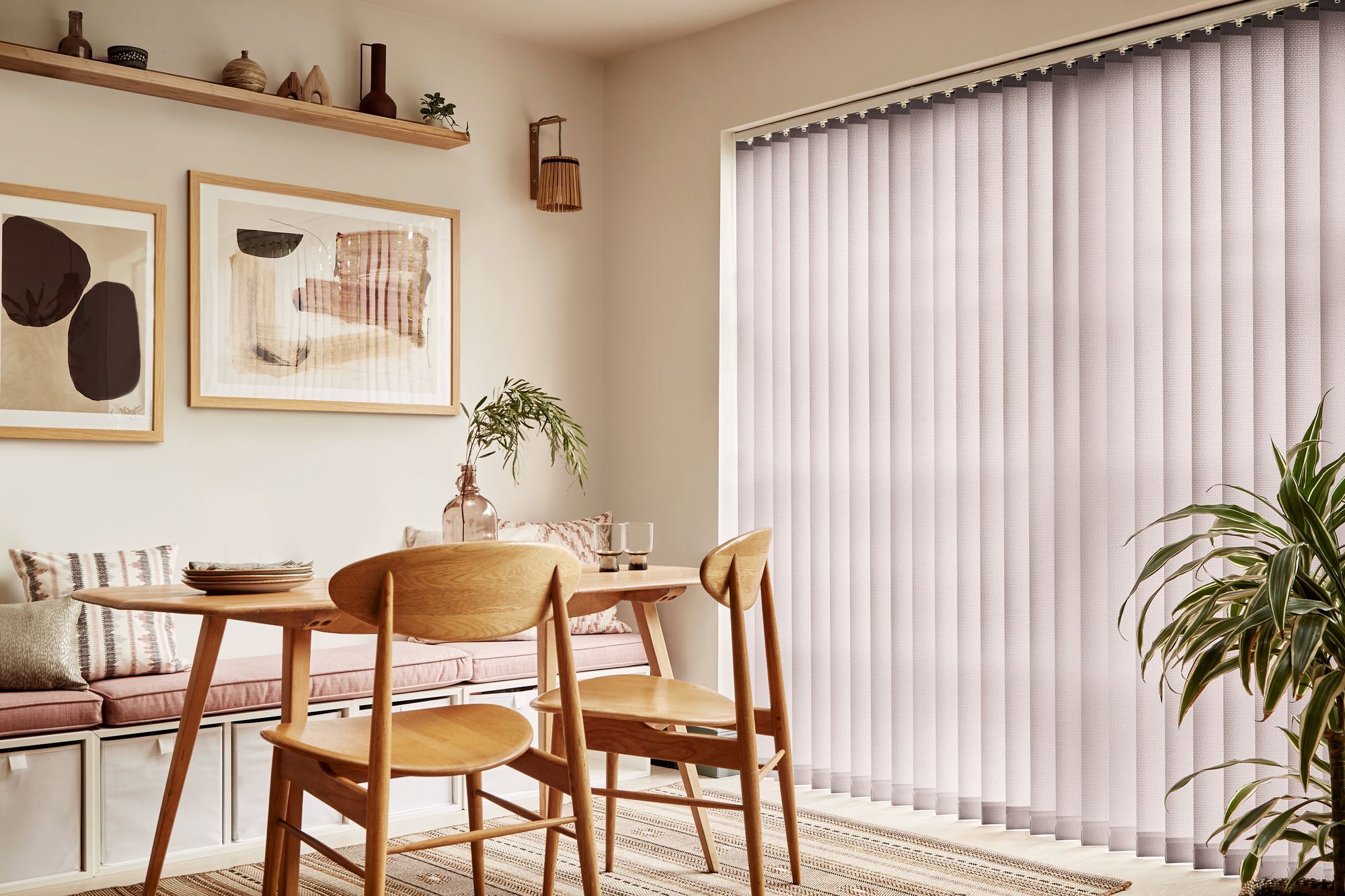 Brown vertical blinds shading tall dining room windows