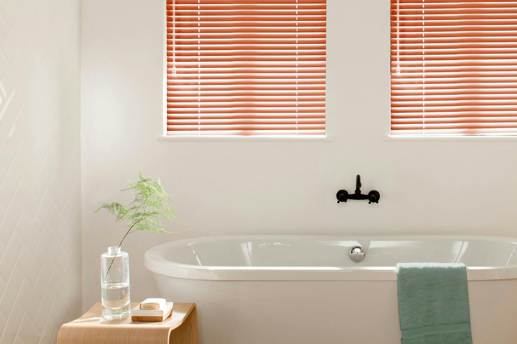 Red russet metal venetian in white bathroom