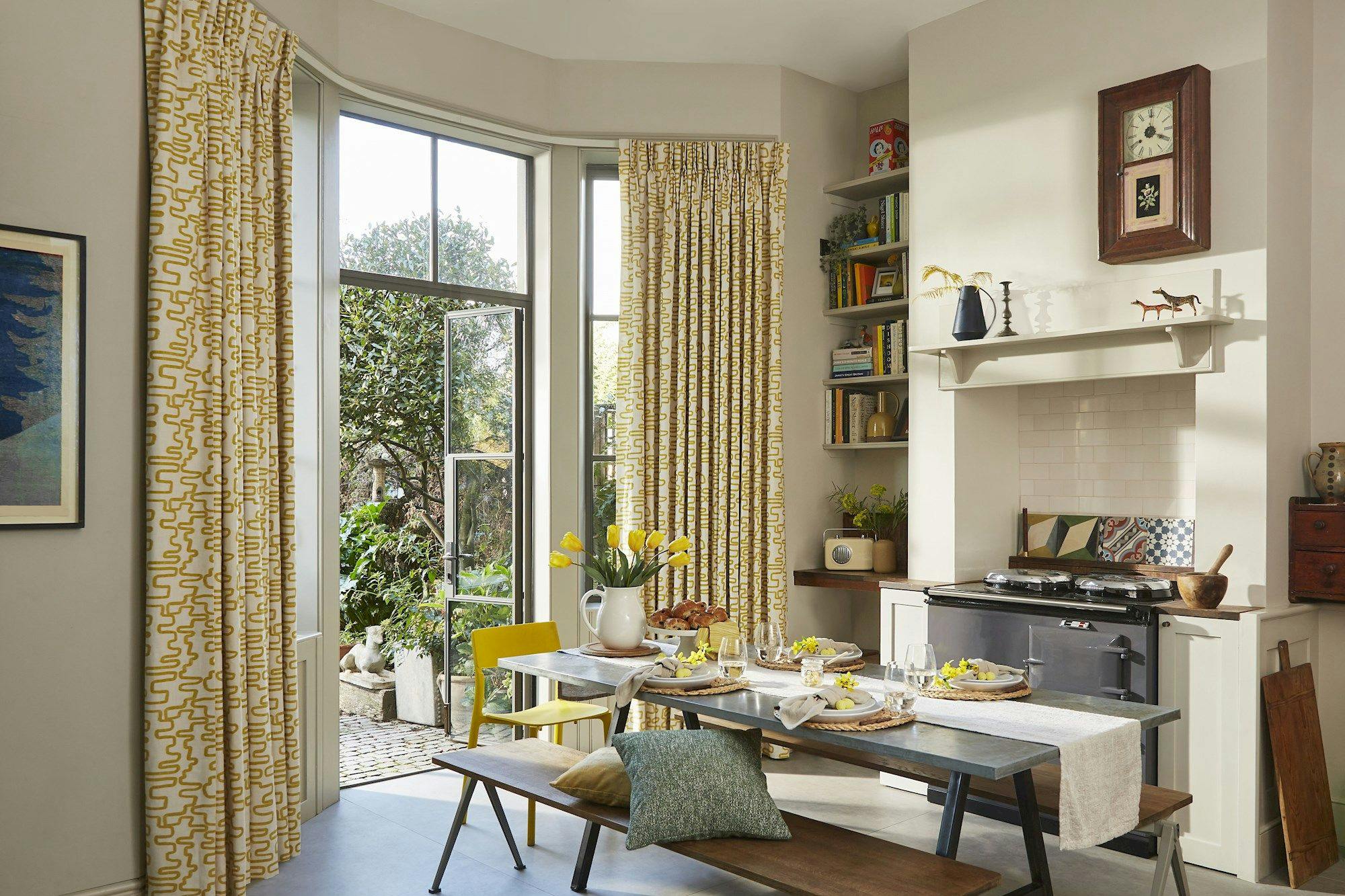 Wirl chartreuse yellow patterned curtains on bay window patio doors in kitchen/dining area