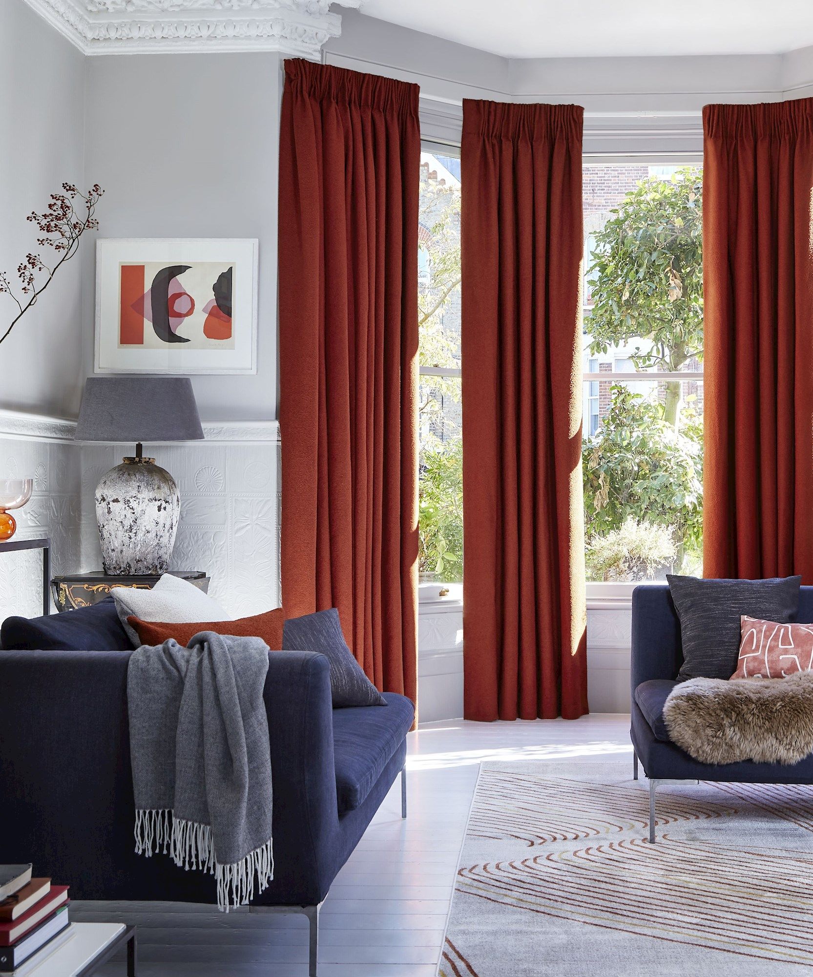 Two pairs of soho boucle spice pinch pleat curtains in bay window in living room