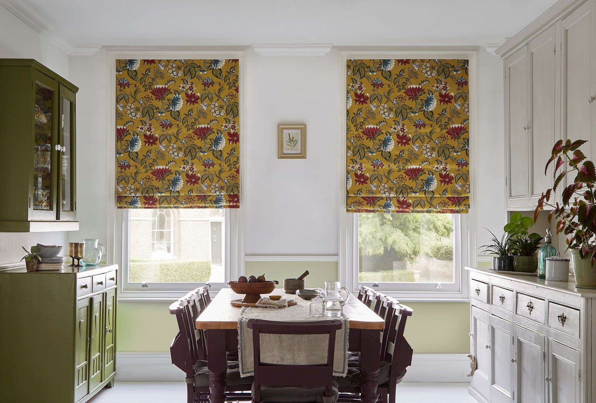 Manisha golden patterned roman blinds in light dining room