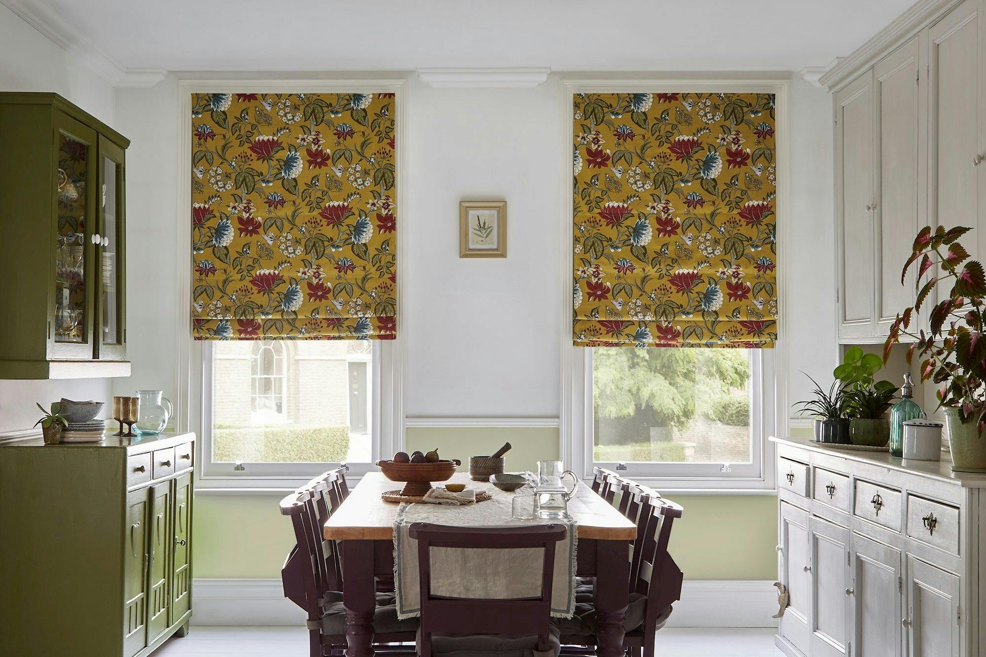 Manisha golden patterned roman blinds in light dining room