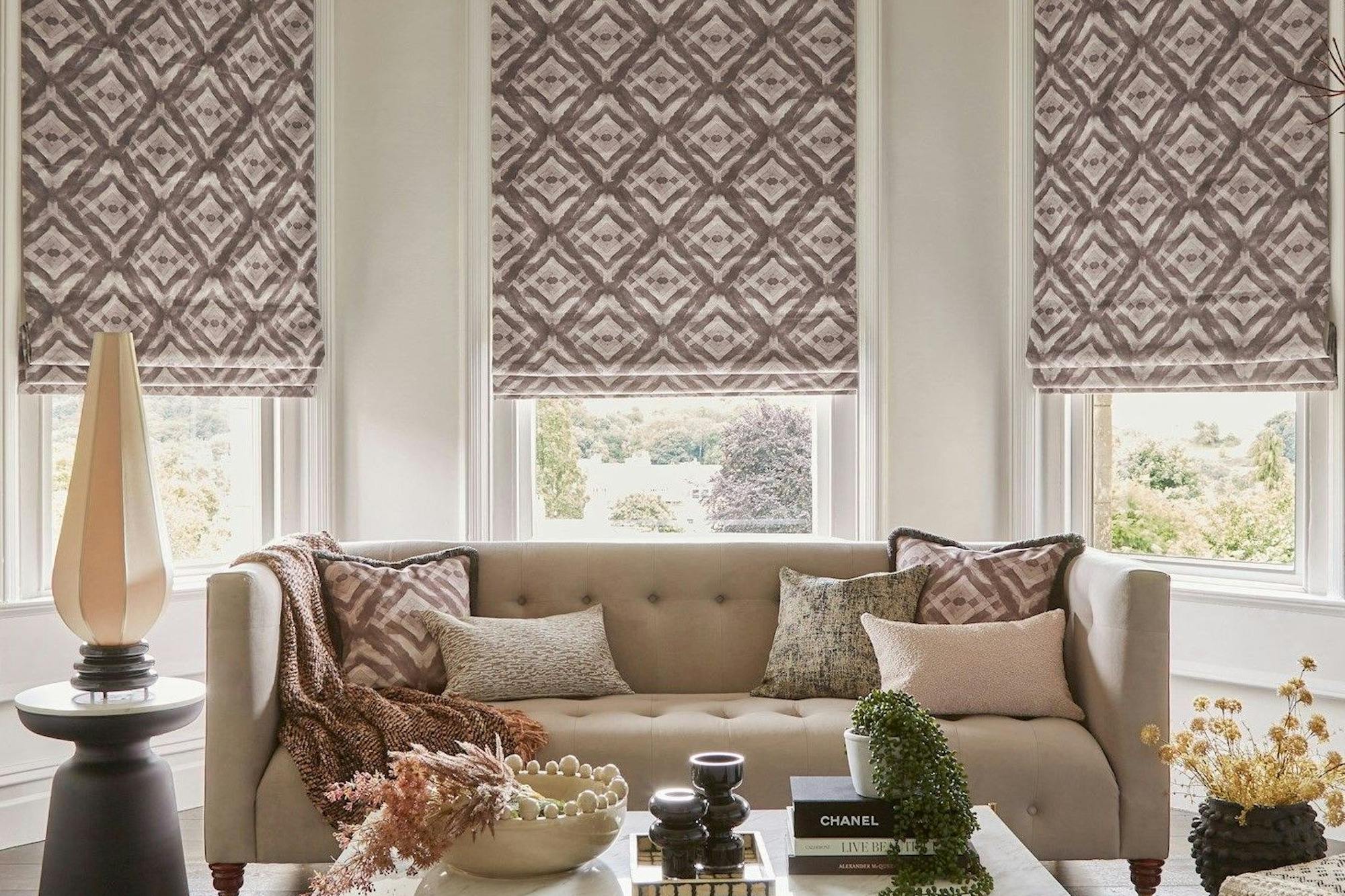 harkness vapour roman blinds on bay window in contemporary living room