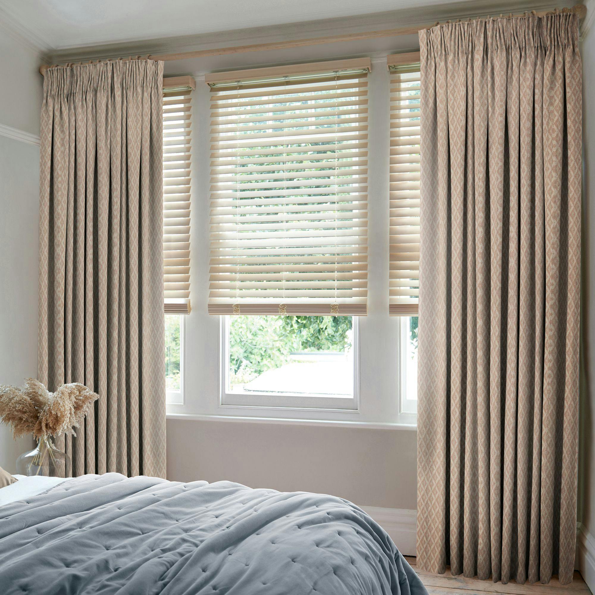 Zircon rosedust floor length pencil pleat curtains in cosy bedroom