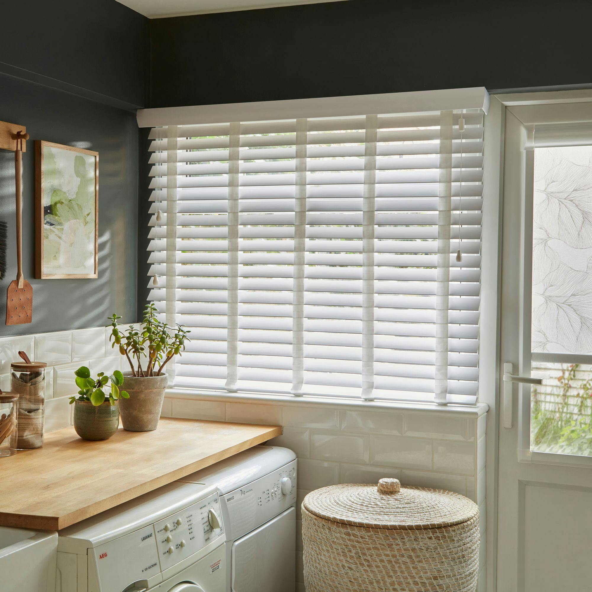 Mirage faux wood pinnacle white venetian blinds with white tape in utility room