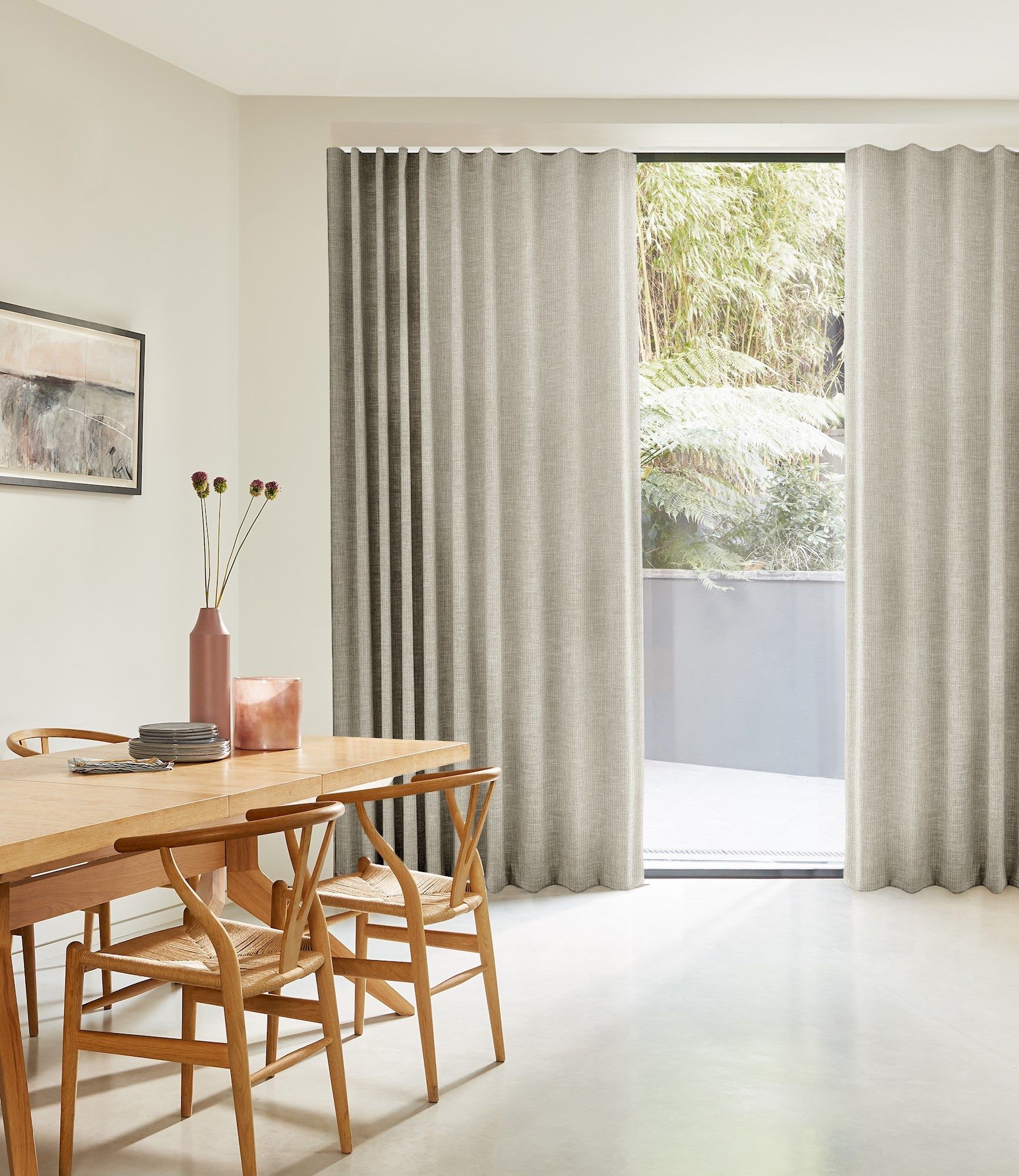 full height maisie almond wave curtains in a white dining room with wooden table