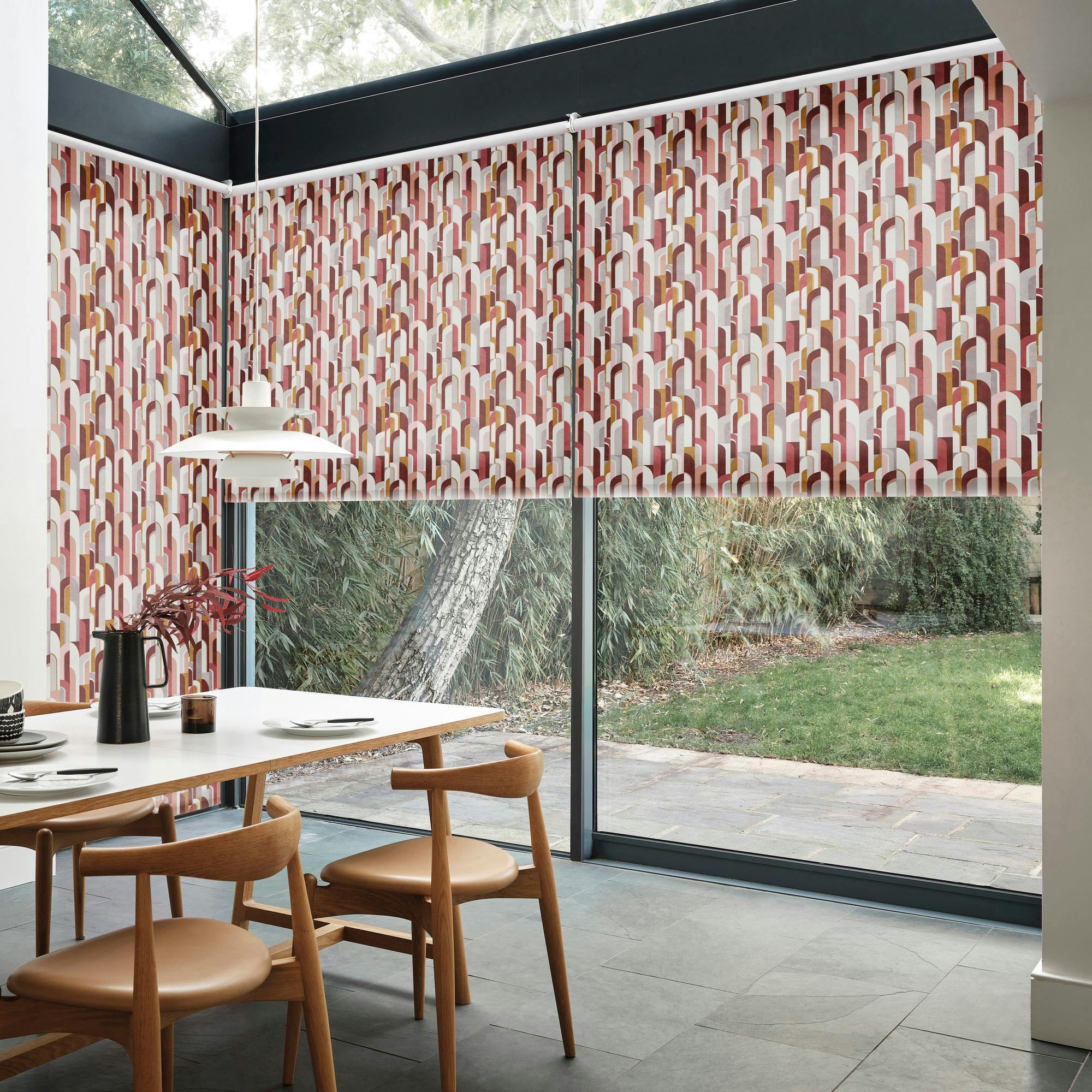 Bauhaus Mauve roller blinds on expansive patio door in open spaced living room