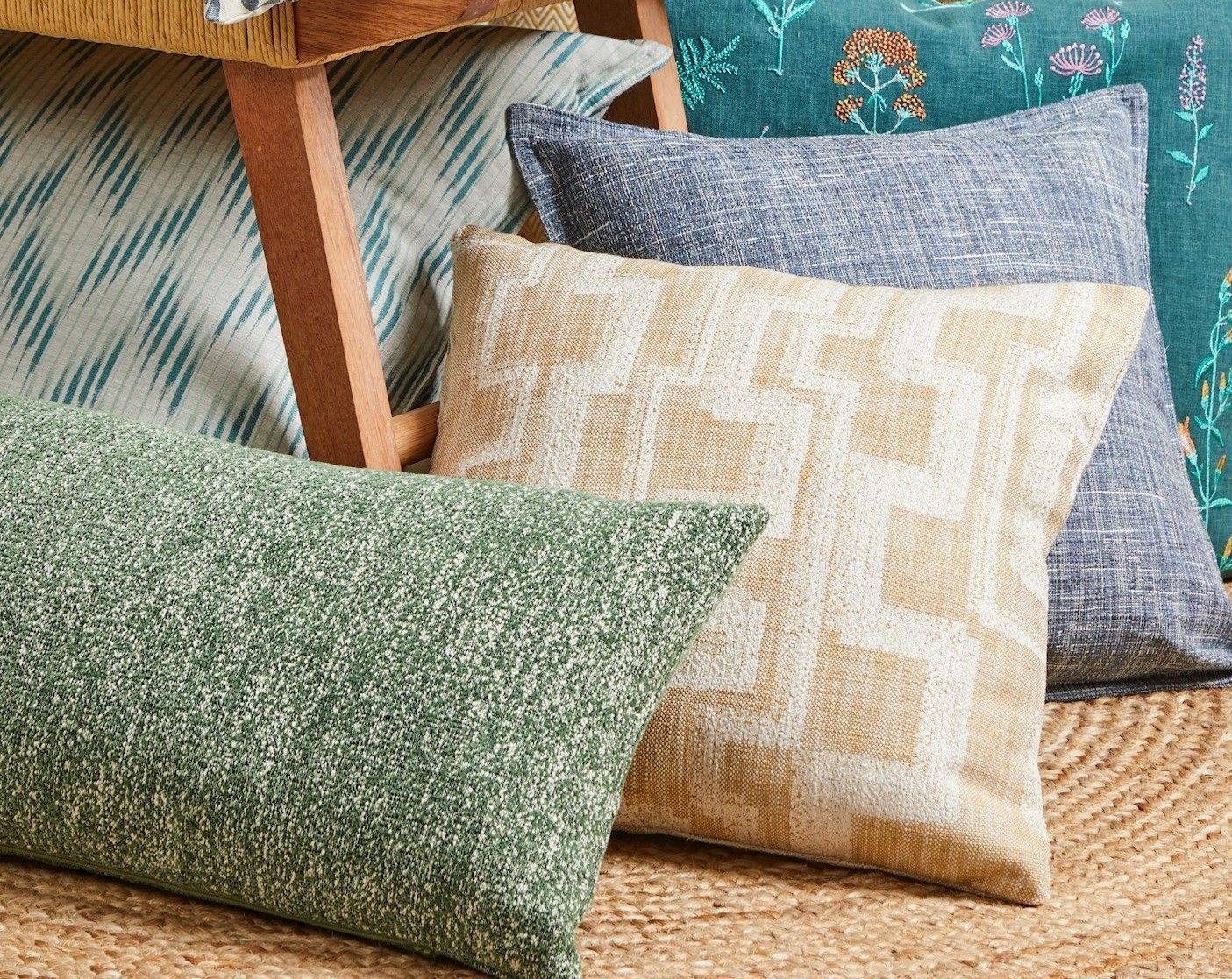 range of cushions featuring fabrics from the 2023 curtains and roman fabric launch