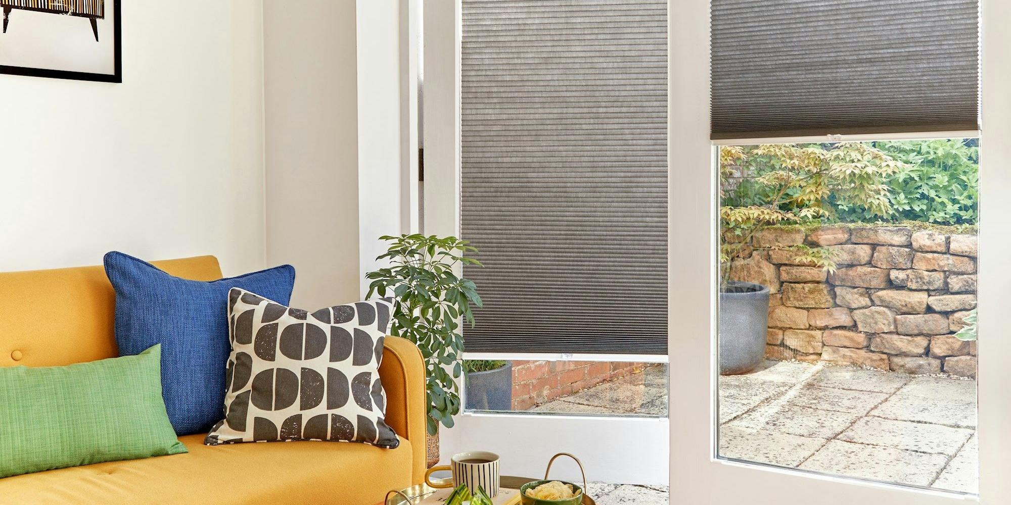 duette charcoal pleated blinds on french doors in living room