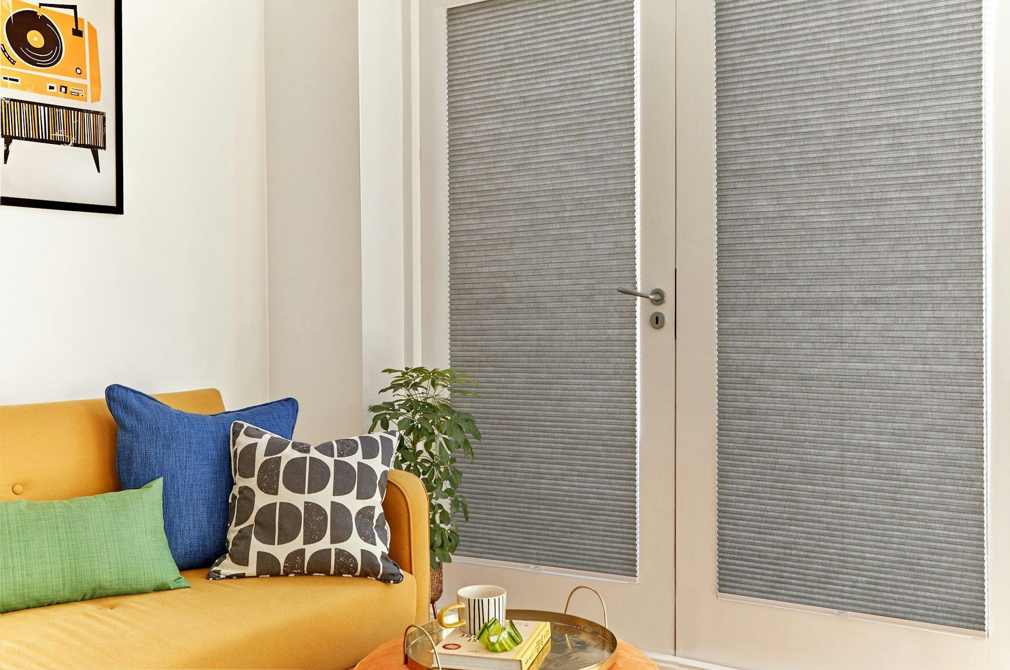 duette charcoal pleated blinds on french doors in living room