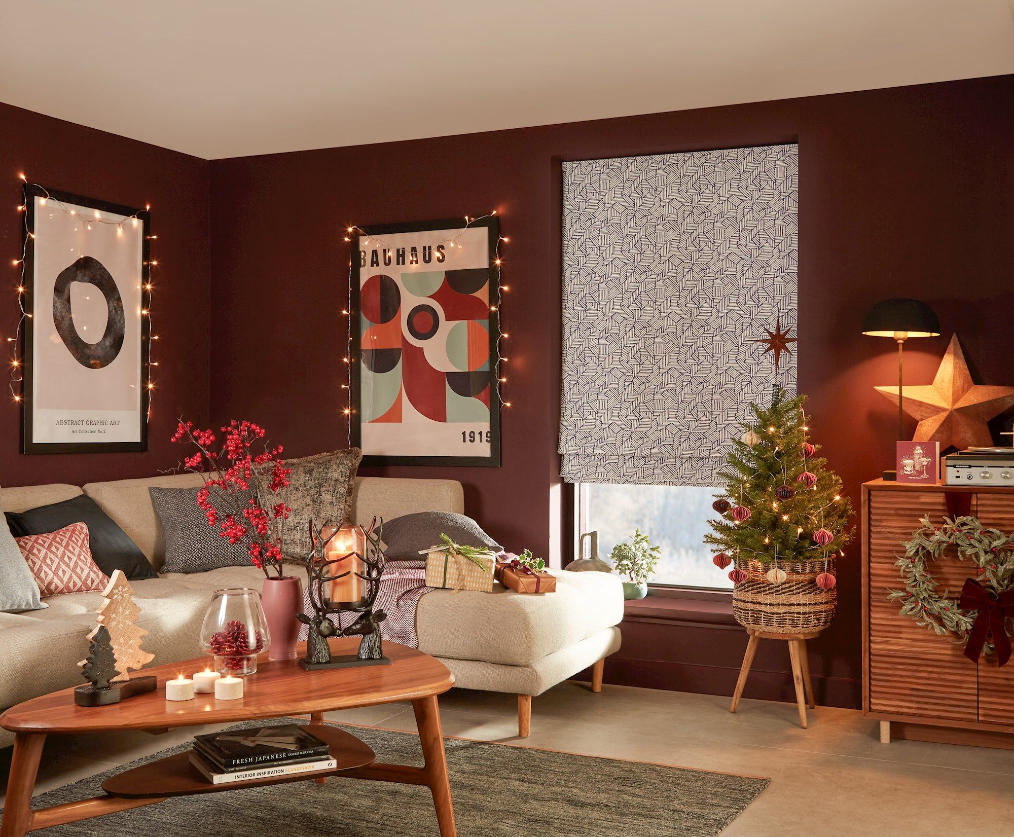 blue geometric patterned roman blind in cosy christmas themed living room