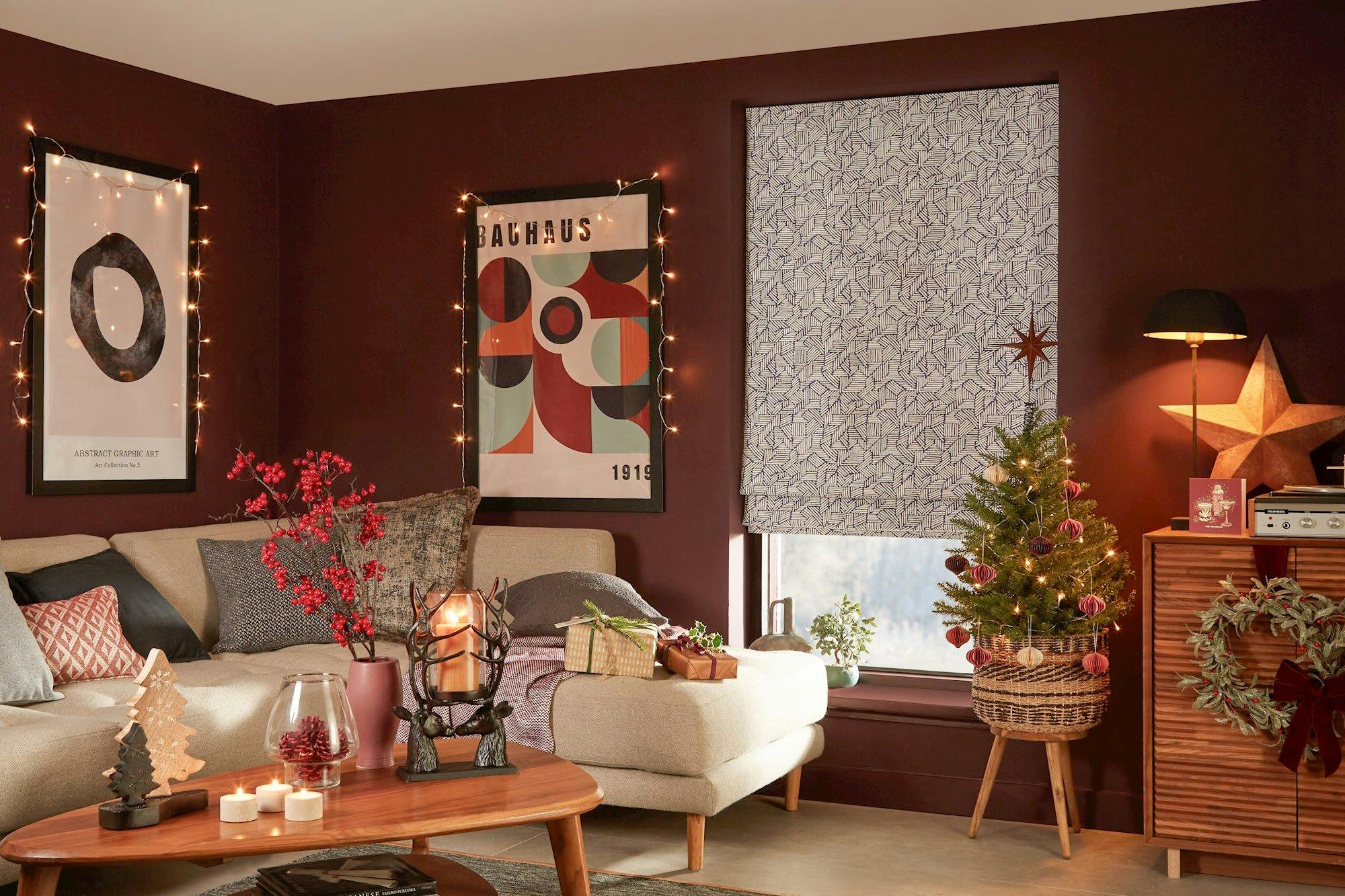 blue geometric patterned roman blind in cosy christmas themed living room