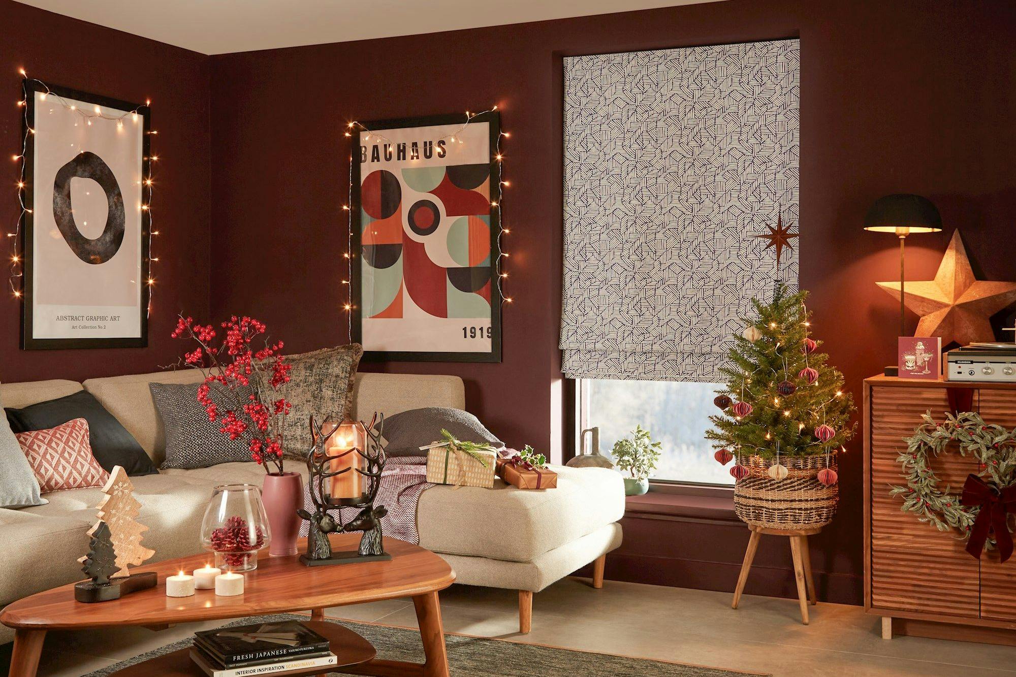blue geometric patterned roman blind in cosy christmas themed living room