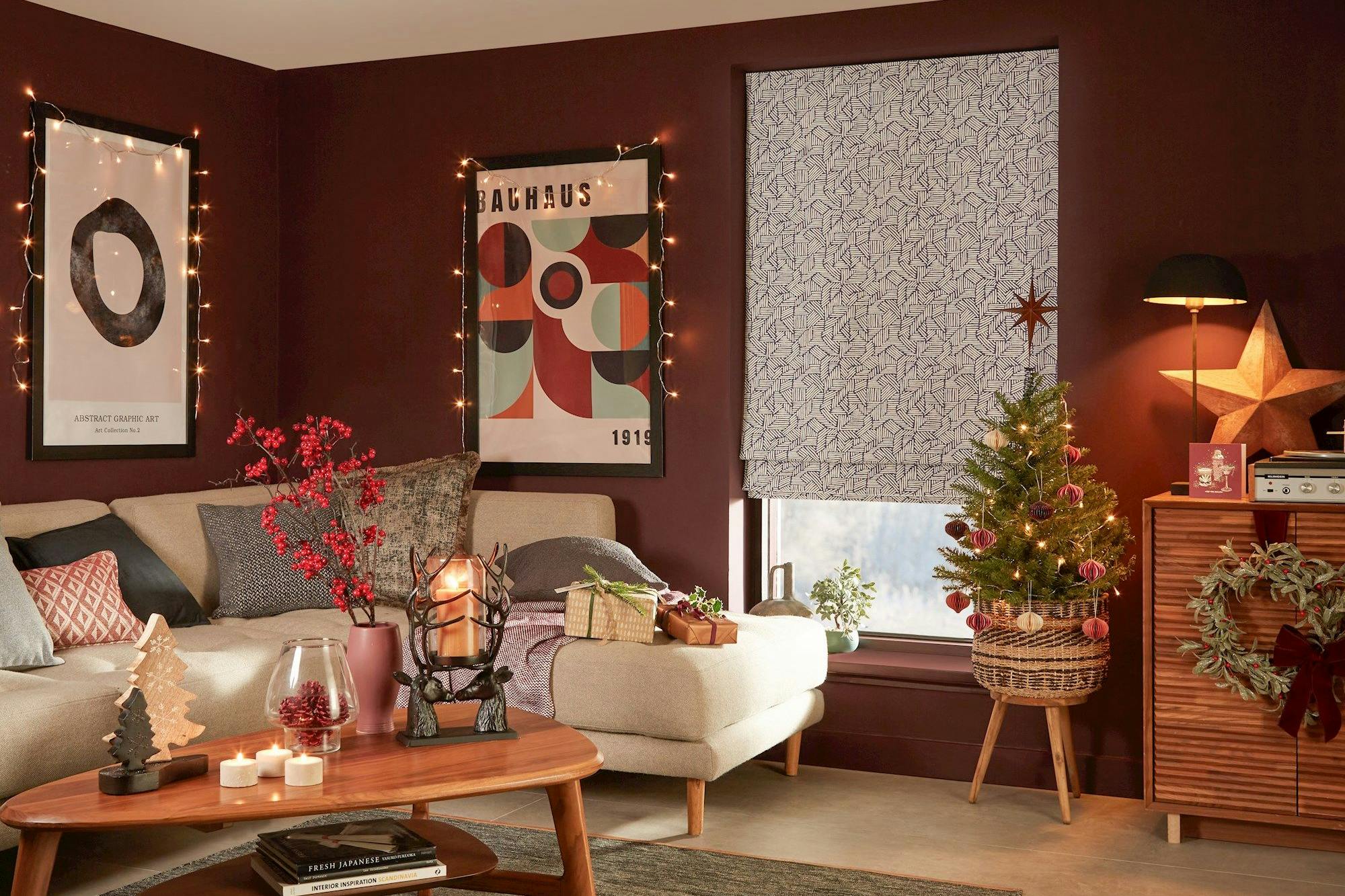 blue geometric patterned roman blind in cosy christmas themed living room