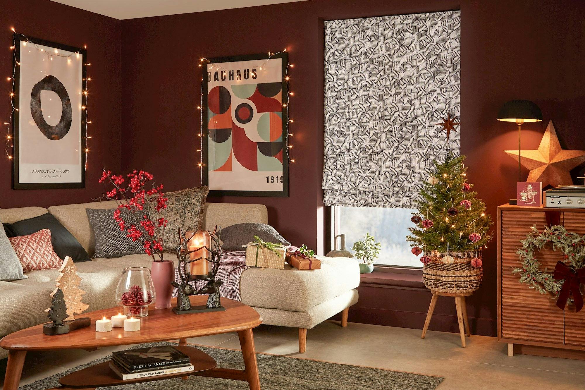 blue geometric patterned roman blind in cosy christmas themed living room