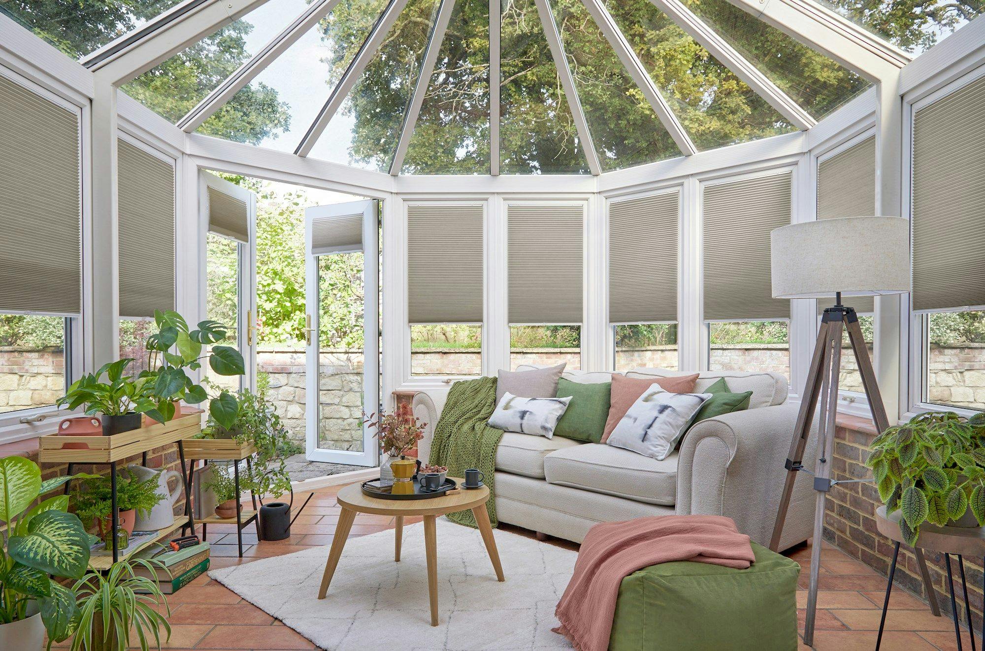 grey duette pleated blinds on windows in circular conservatory
