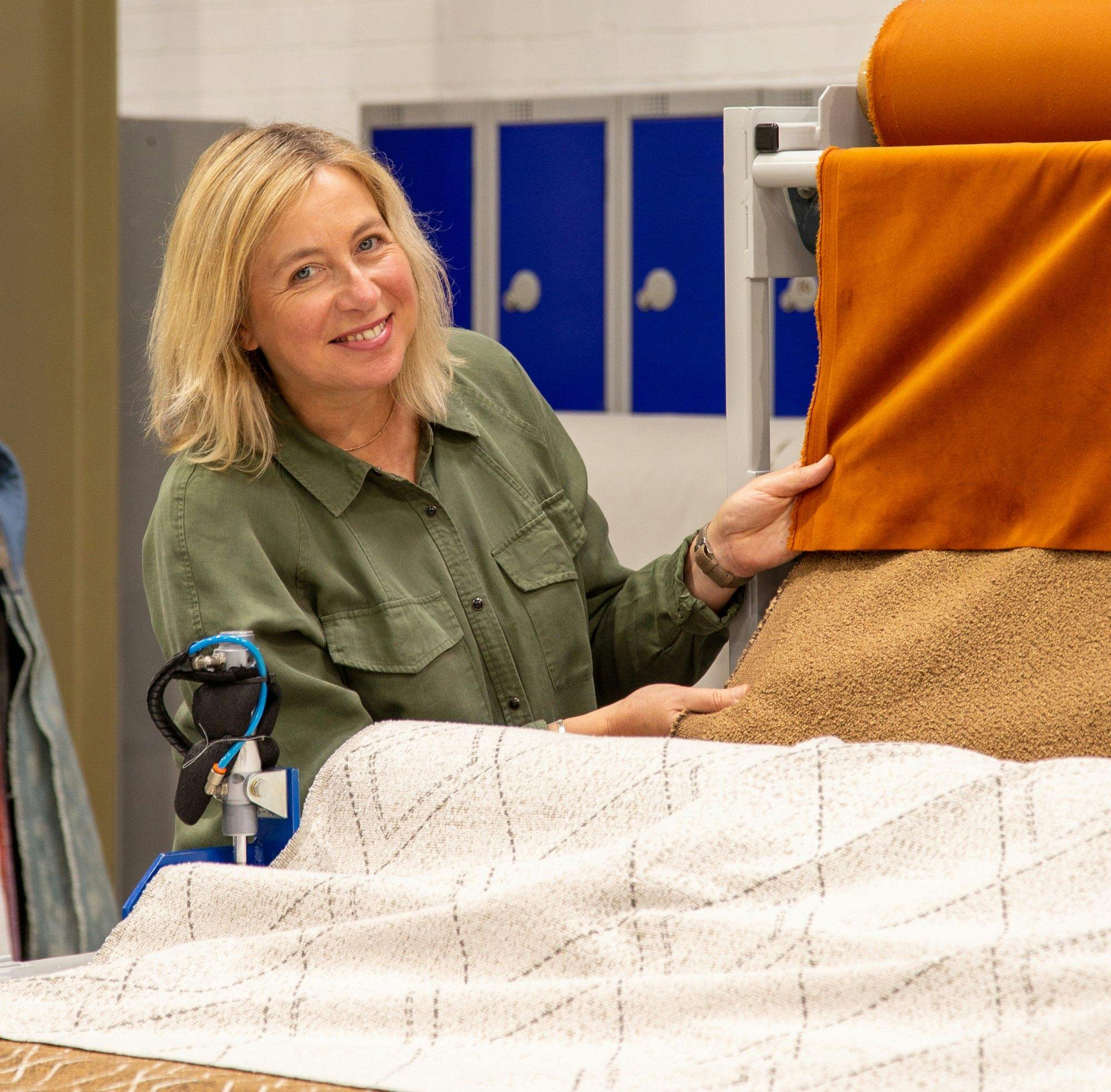 Yvonne kneel product designer holding roman blind