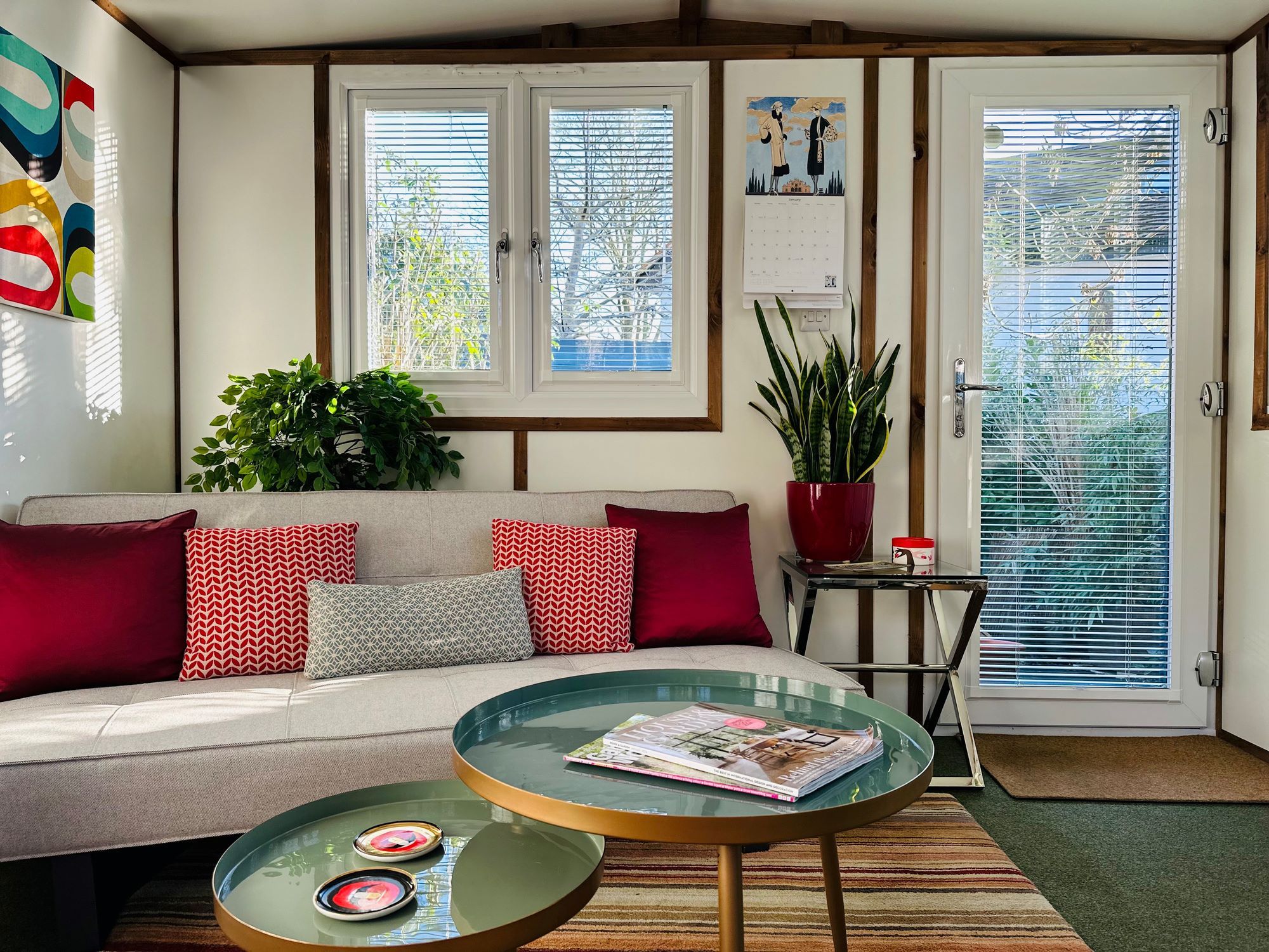 A-living-room-with-a-couch-a-stylish-coffee-table-a-window-adorned-with-perfect-fit-Venetian-metal-blinds