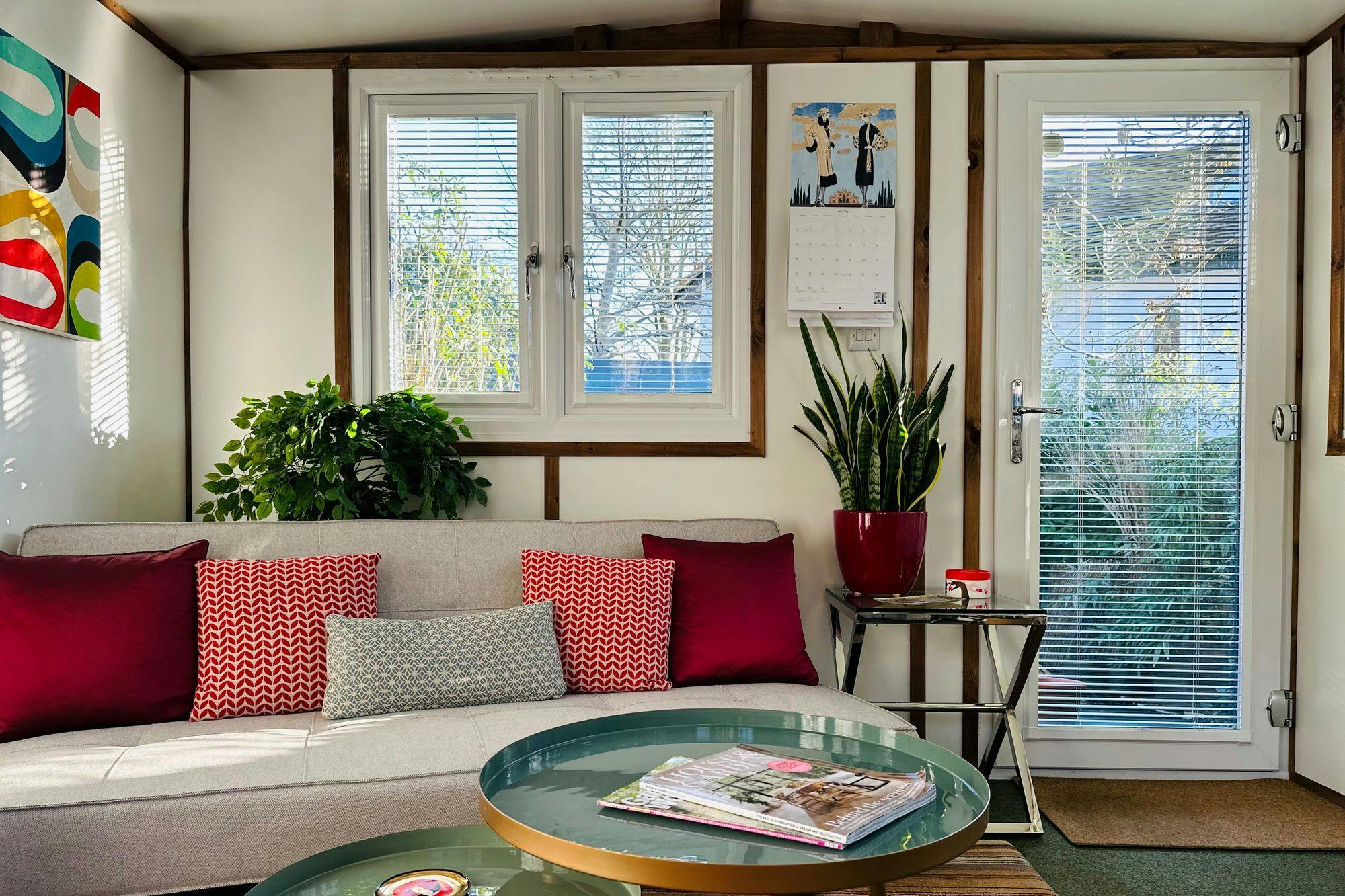 A-living-room-with-a-couch-a-stylish-coffee-table-a-window-adorned-with-perfect-fit-Venetian-metal-blinds