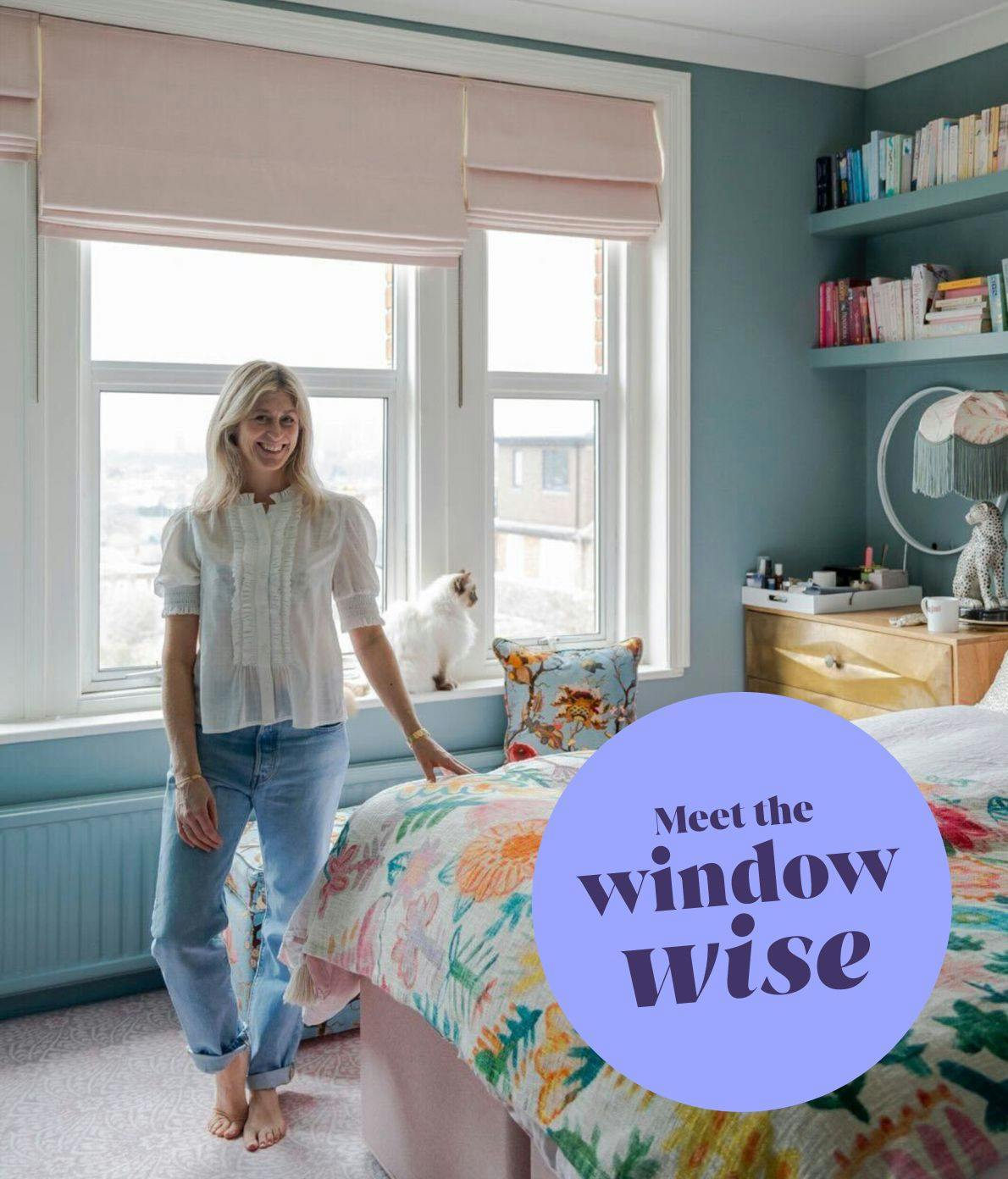 A person stands barefoot beside a floral bedspread, with a cat perched on a windowsill. Pastel-colored books and a lamp decorate the teal room. Text reads, "Meet the window wise."