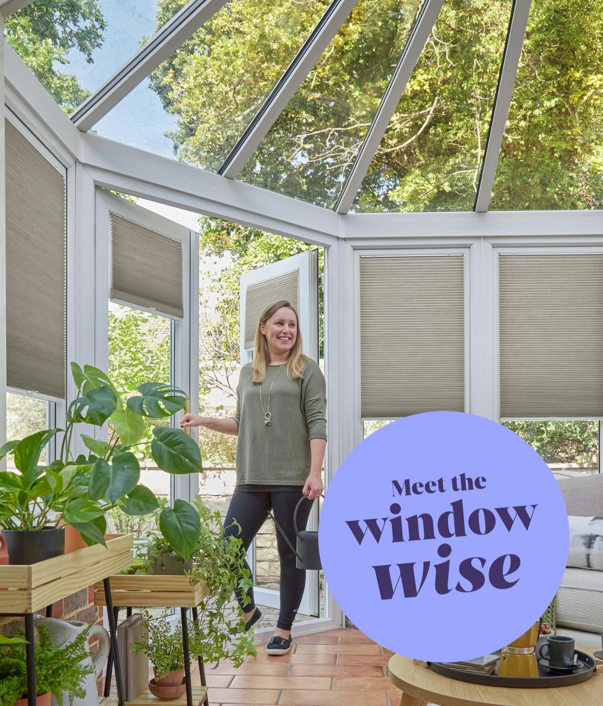 A woman holding a watering can enters a conservatory filled with plants and natural light. Text reads, "Meet the window wise" against a large purple circle.