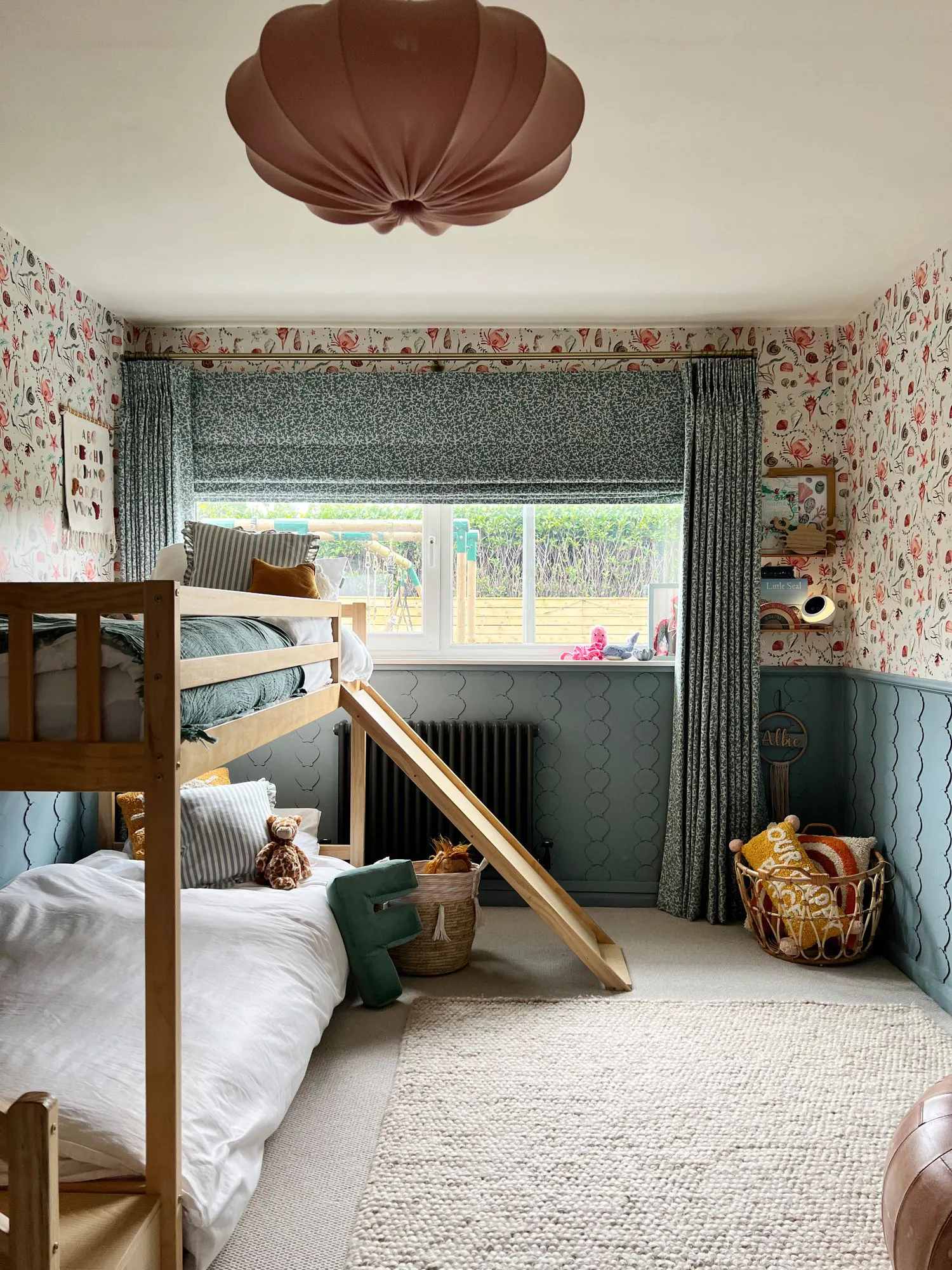 INTERIOR SQUAD MEL C CORAL PACIFIC ROMAN BLIND AND CURTAIN BEDROOM
