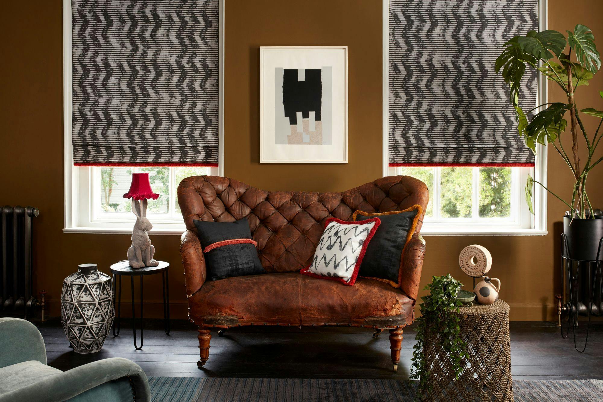 Hillarys Abigail Ahern Cadillac Noir Roman Blind with Colette Vixen Fringing in the dining room