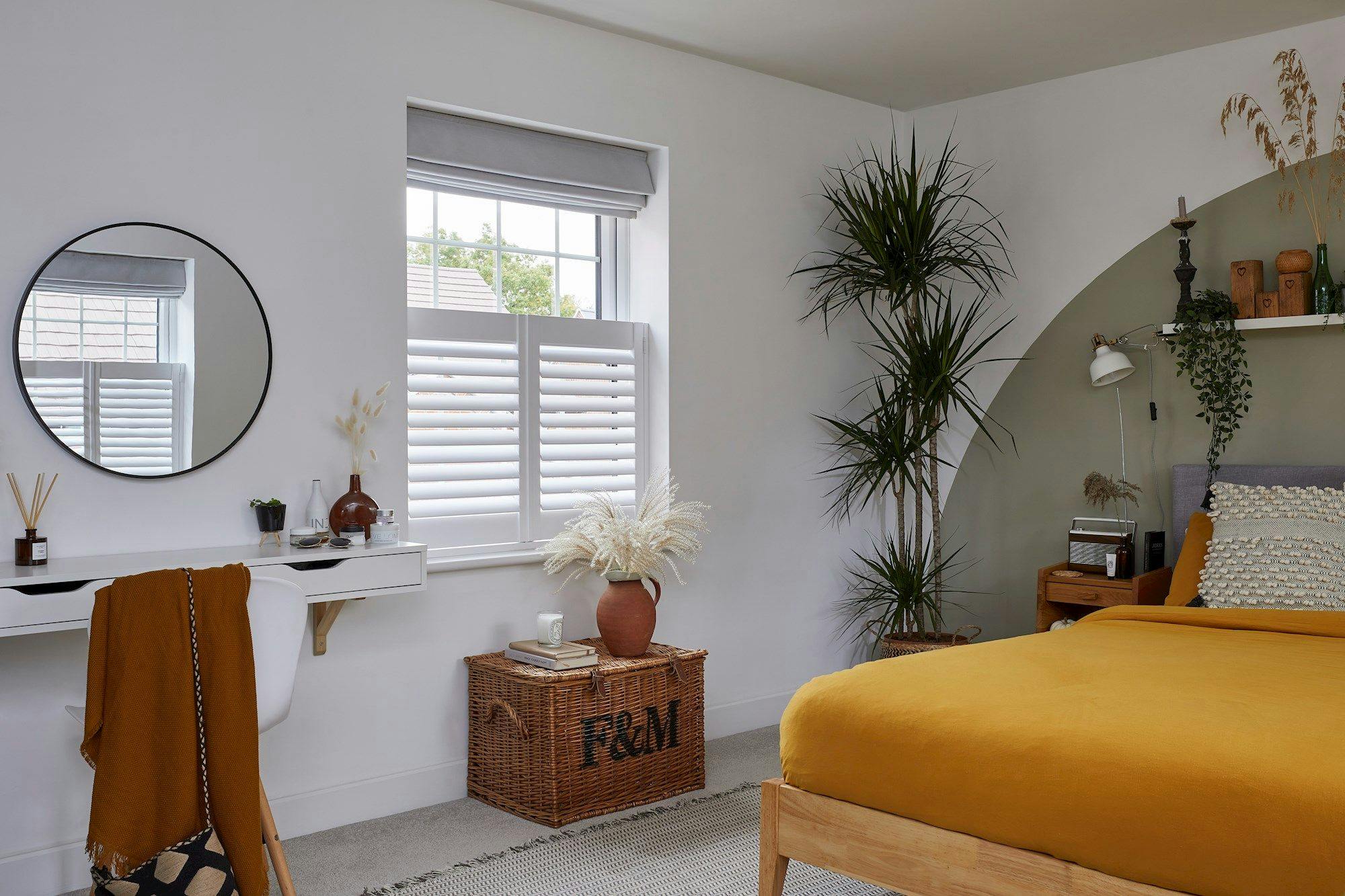 pure white cafe shutters in bedroom paired with tetbury silver roman blinds