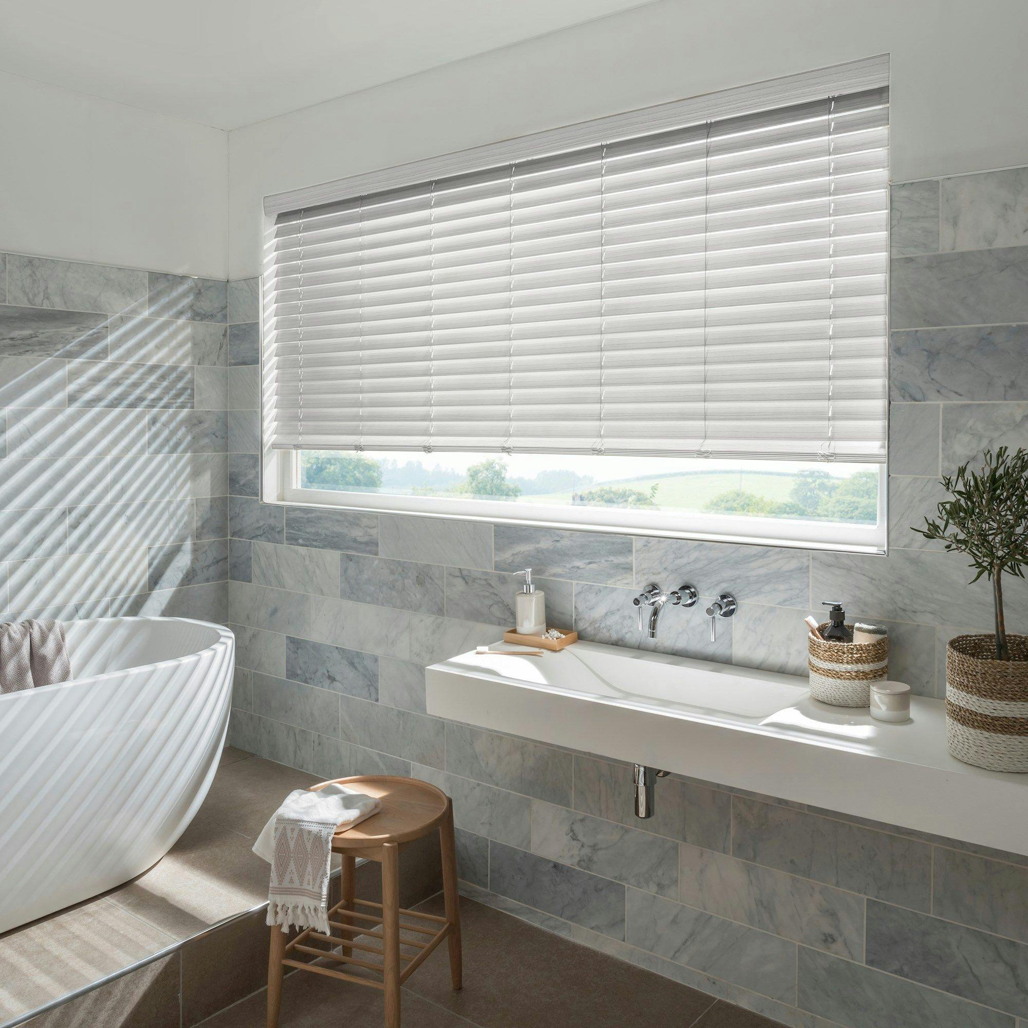 natural stone faux wood white blinds in bathroom