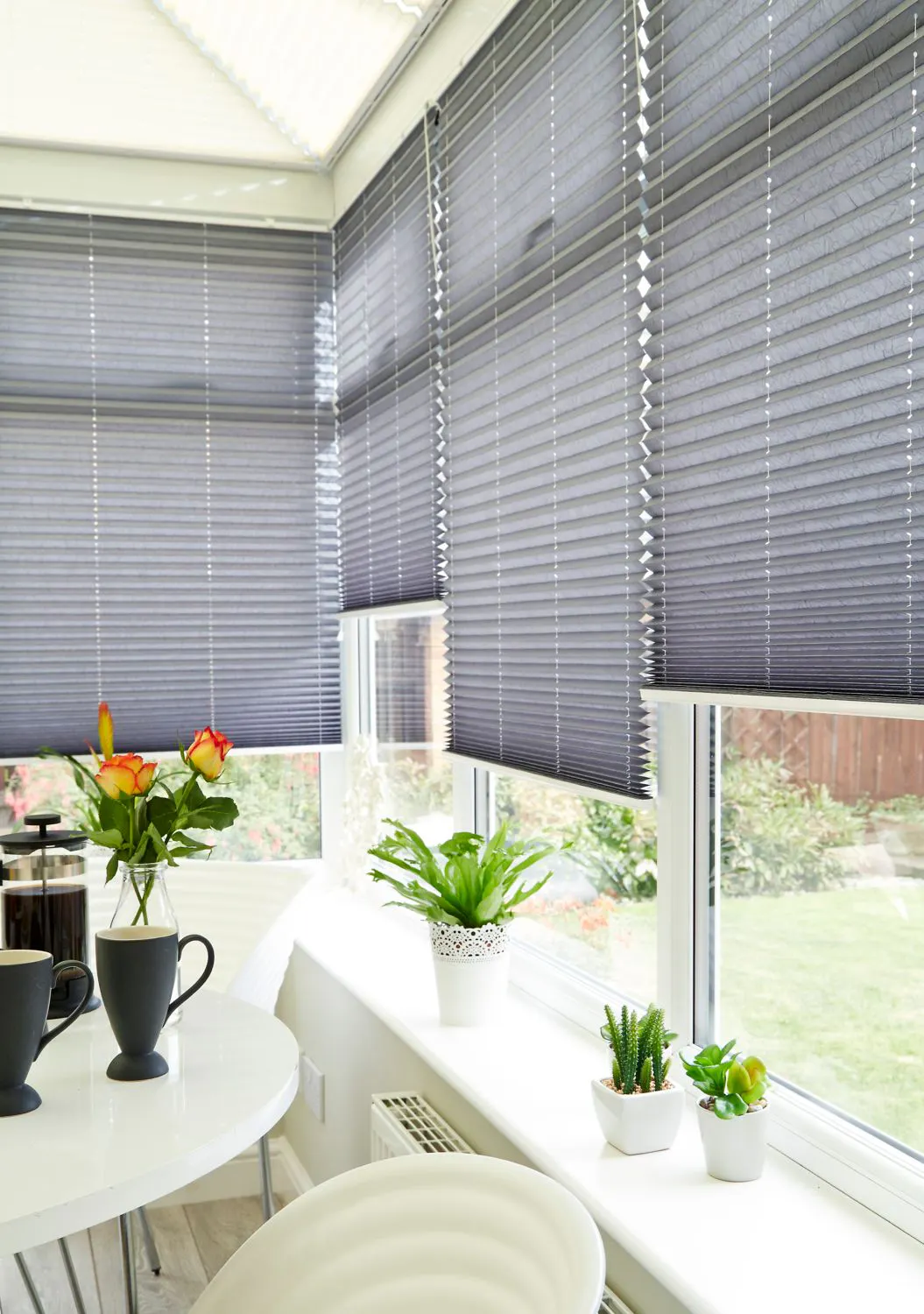 Crush Charcoal Pleated blind in conservatory
