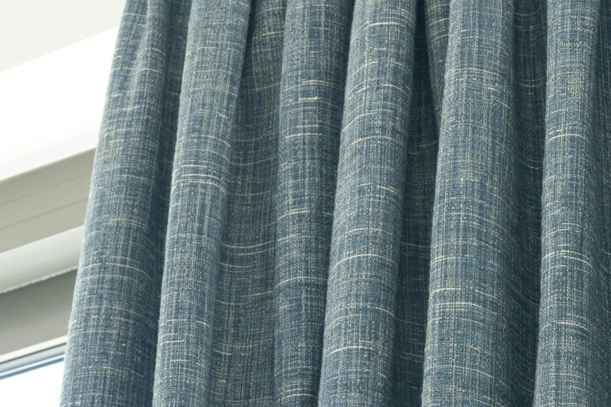 Close up detail of triple pinch pleat header style on Haddie Ocean curtains