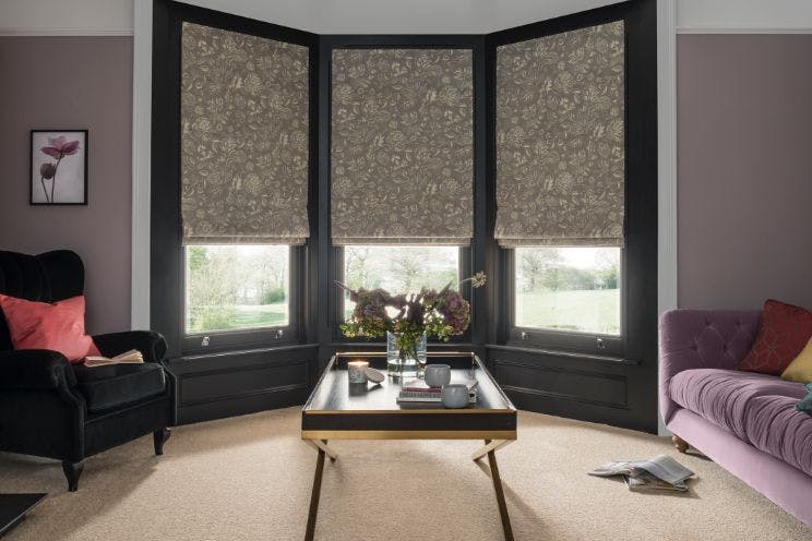 living room with oralia dove roman blinds in bay window
