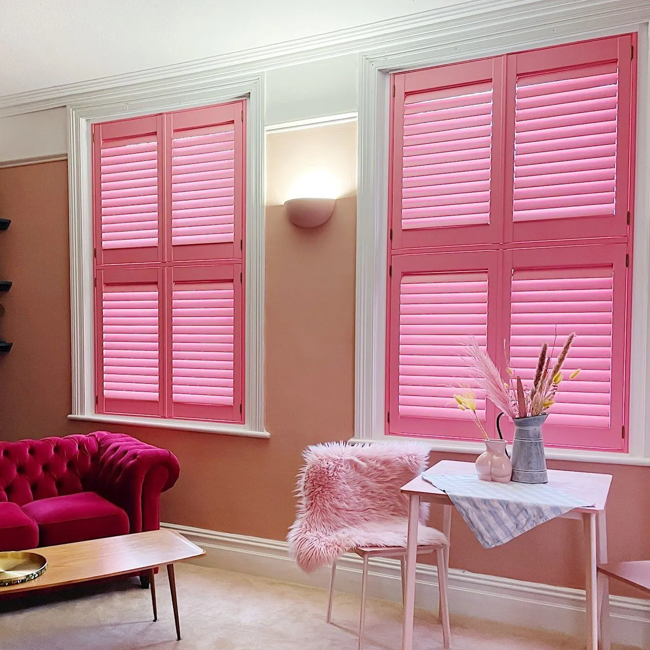tier on tier barbie pink closed shutters in elegant pink themed living room
