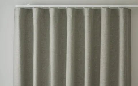 Close up of a beige wave header curtain