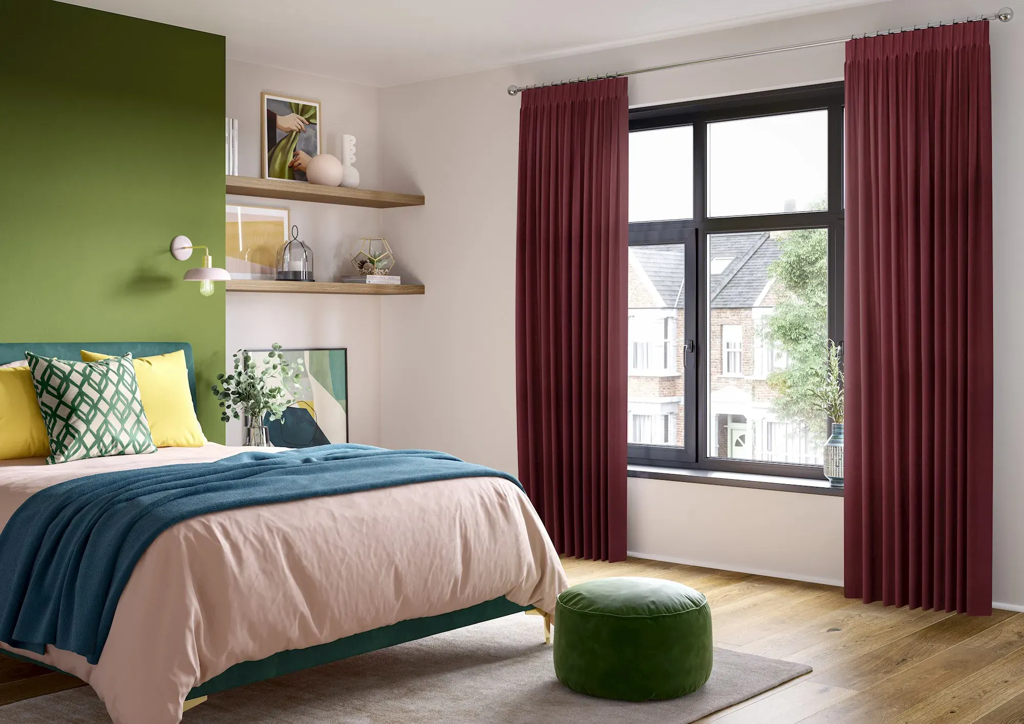 A vibrant bedroom with plum-coloured curtains and a sage-green accent wall. The double bed is styled with pink bedding, teal throws and yellow and green cushions.