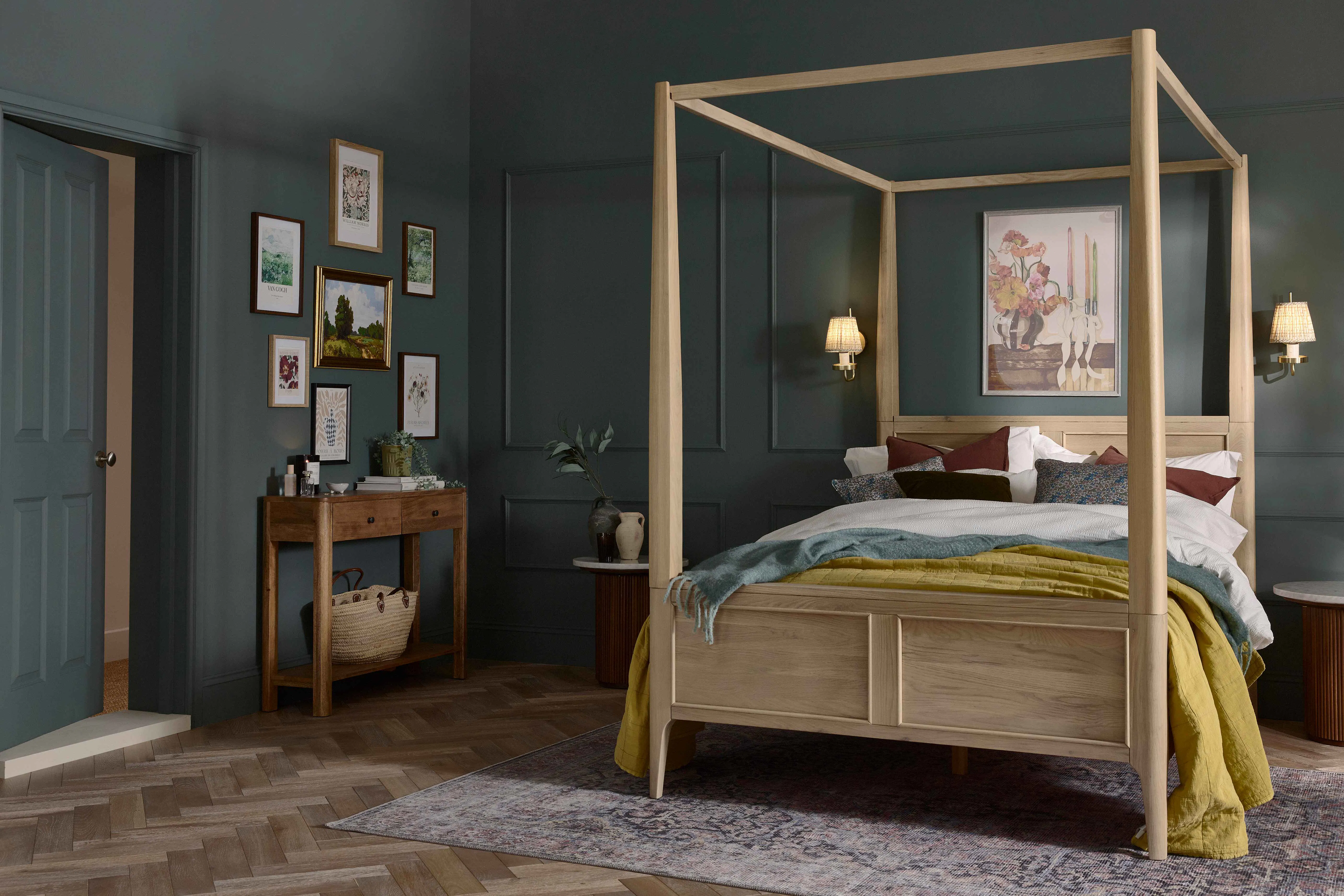 Oak furniture land four post bed in dark green bedroom