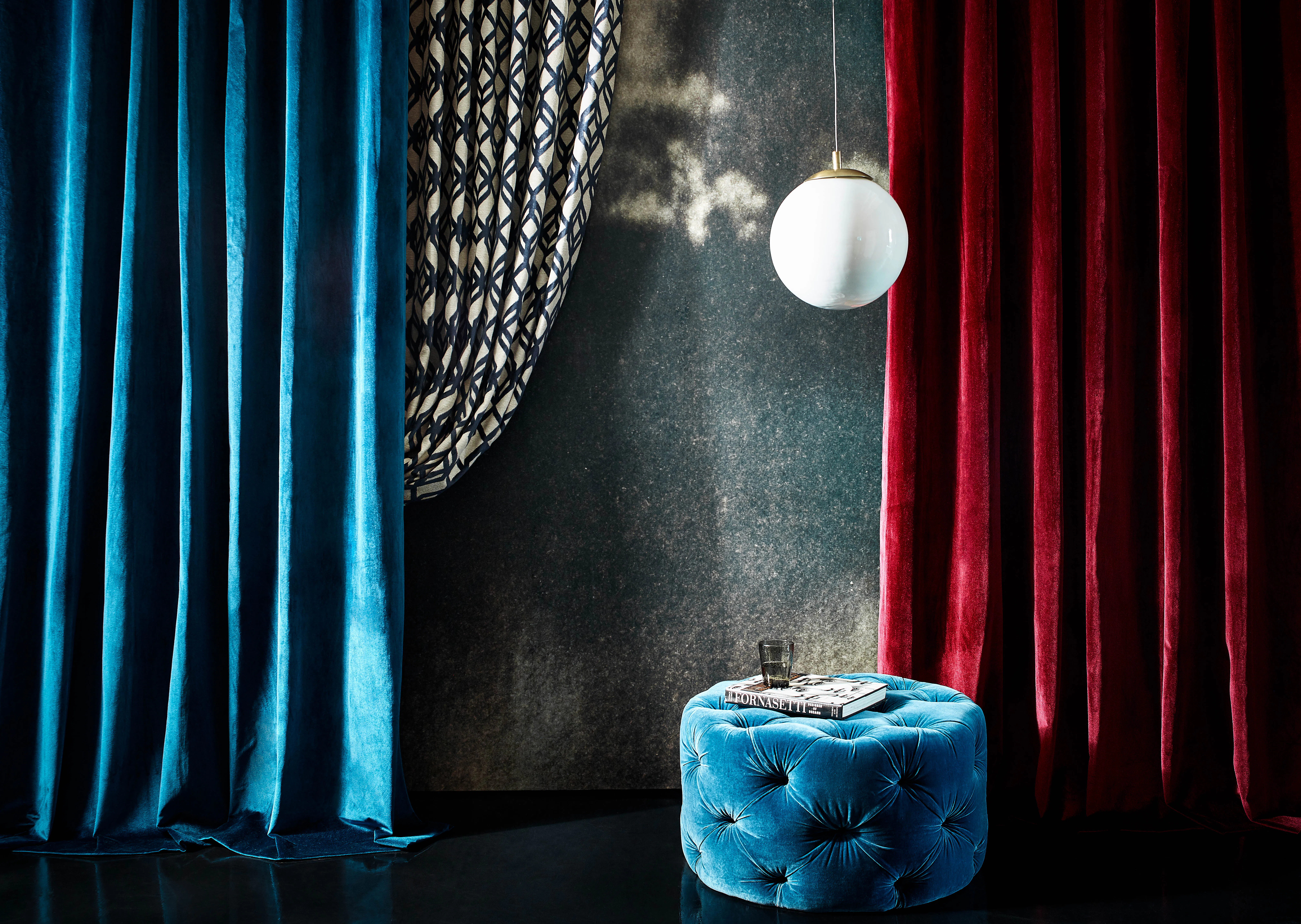 blue and red velvet curtains hanging from floor to ceiling