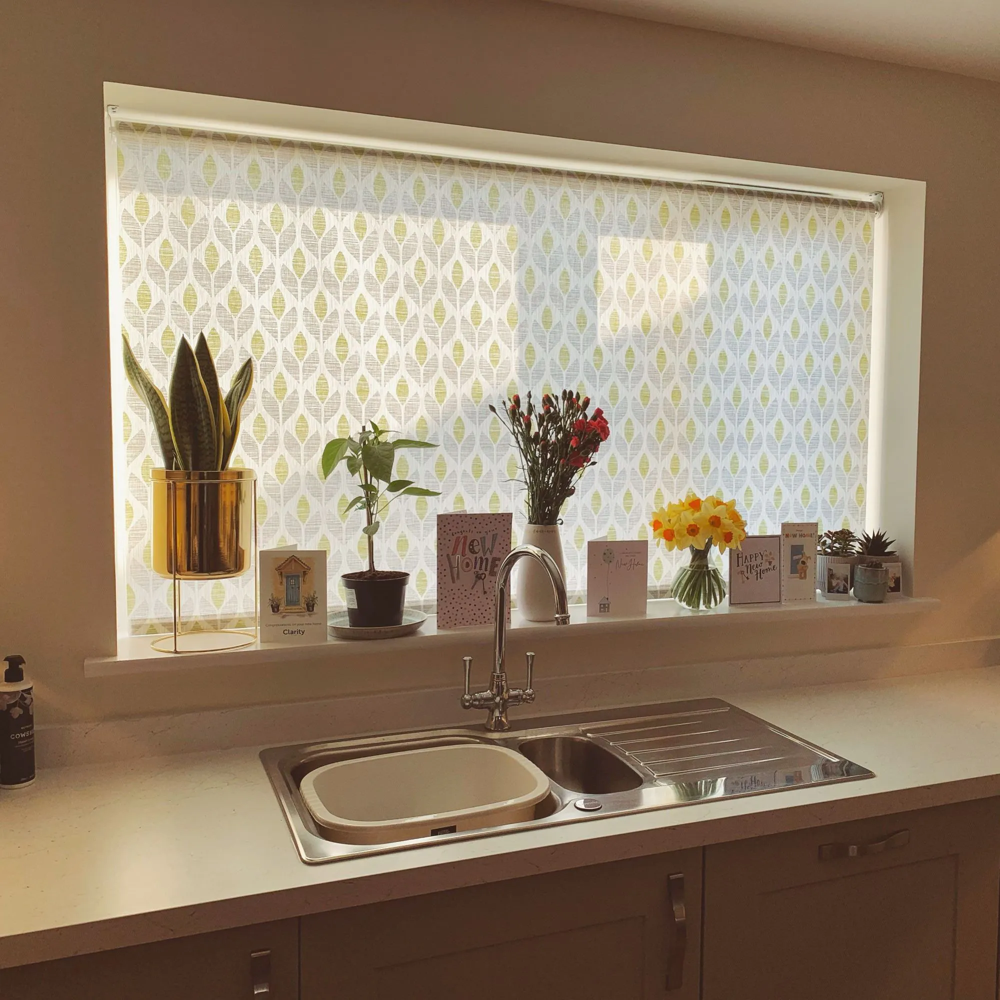 Petula olive roller blind grey and yellow floral in kitchen