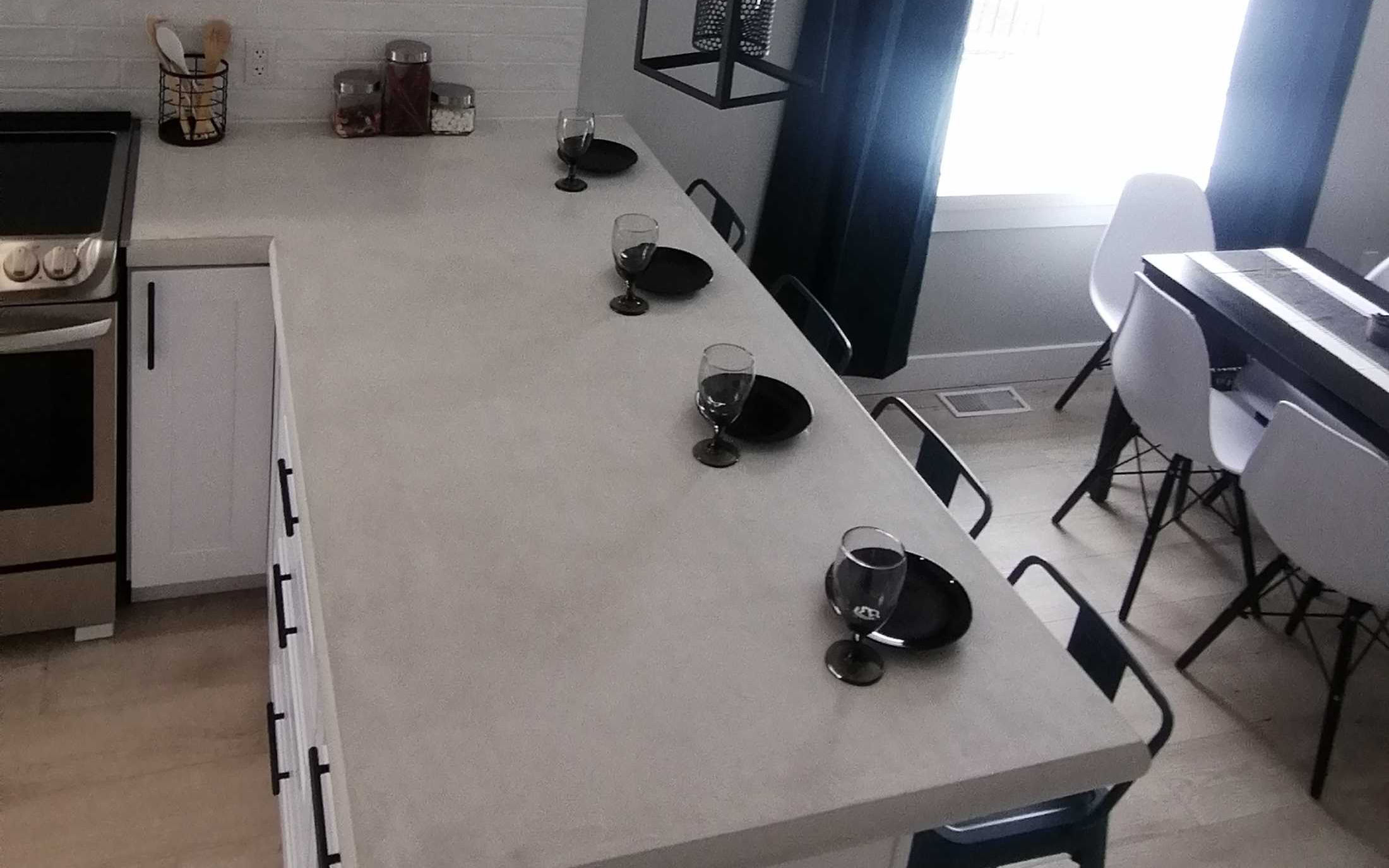 Kitchen nook with chic custom lighting designed by Hint of Honey