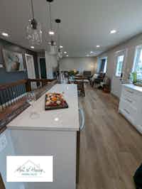 Spacious modern kitchen and dining area, designed by Hint of Honey