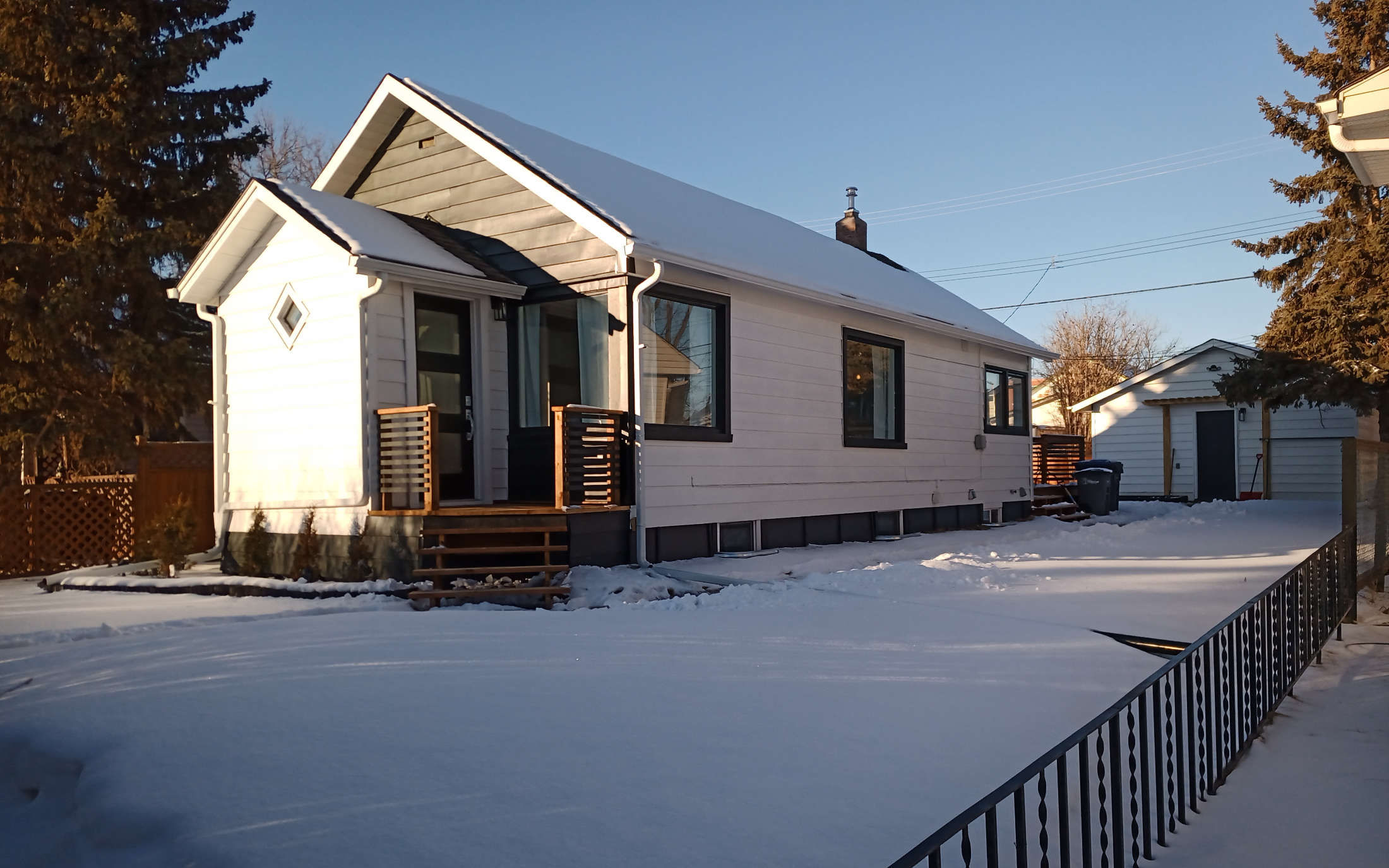 Modern white executive designer home in Dawson Creek, BC. Designed by Hint of Honey