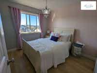 Renovated girl's bedroom with pink accents and modern touches - Hint of Honey