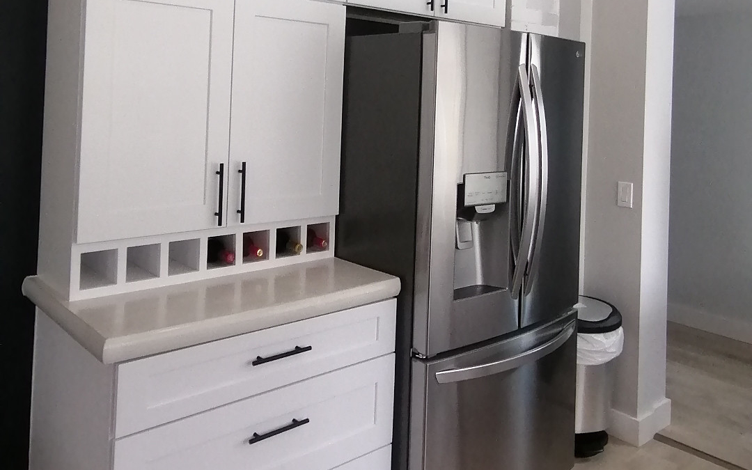 Stainless fridge with white cupboards in modern kitchen - Hint of Honey